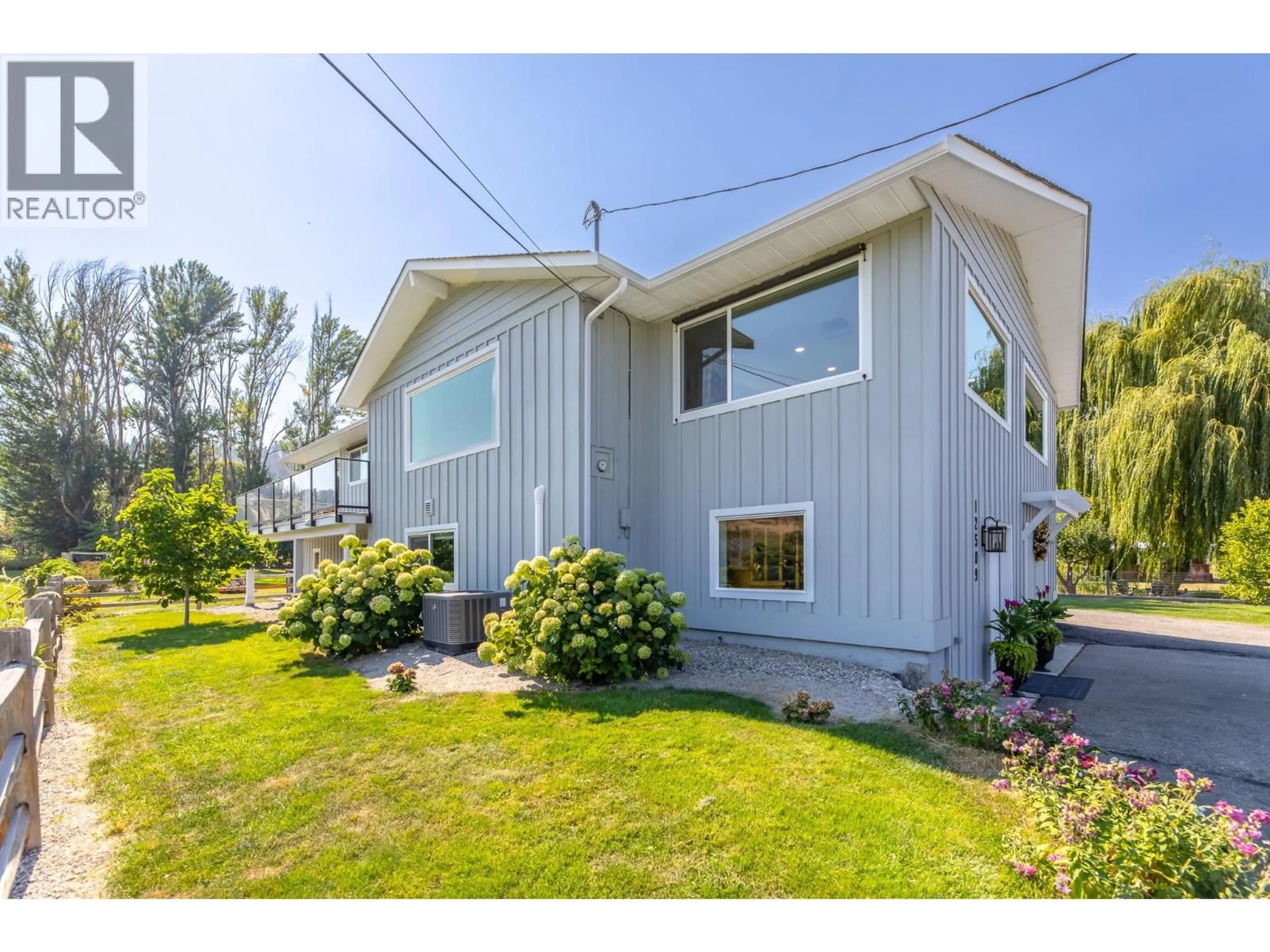 Home with vinyl exterior material, street for 12509 DALE MEADOWS ROAD, Summerland British Columbia V0H1Z8