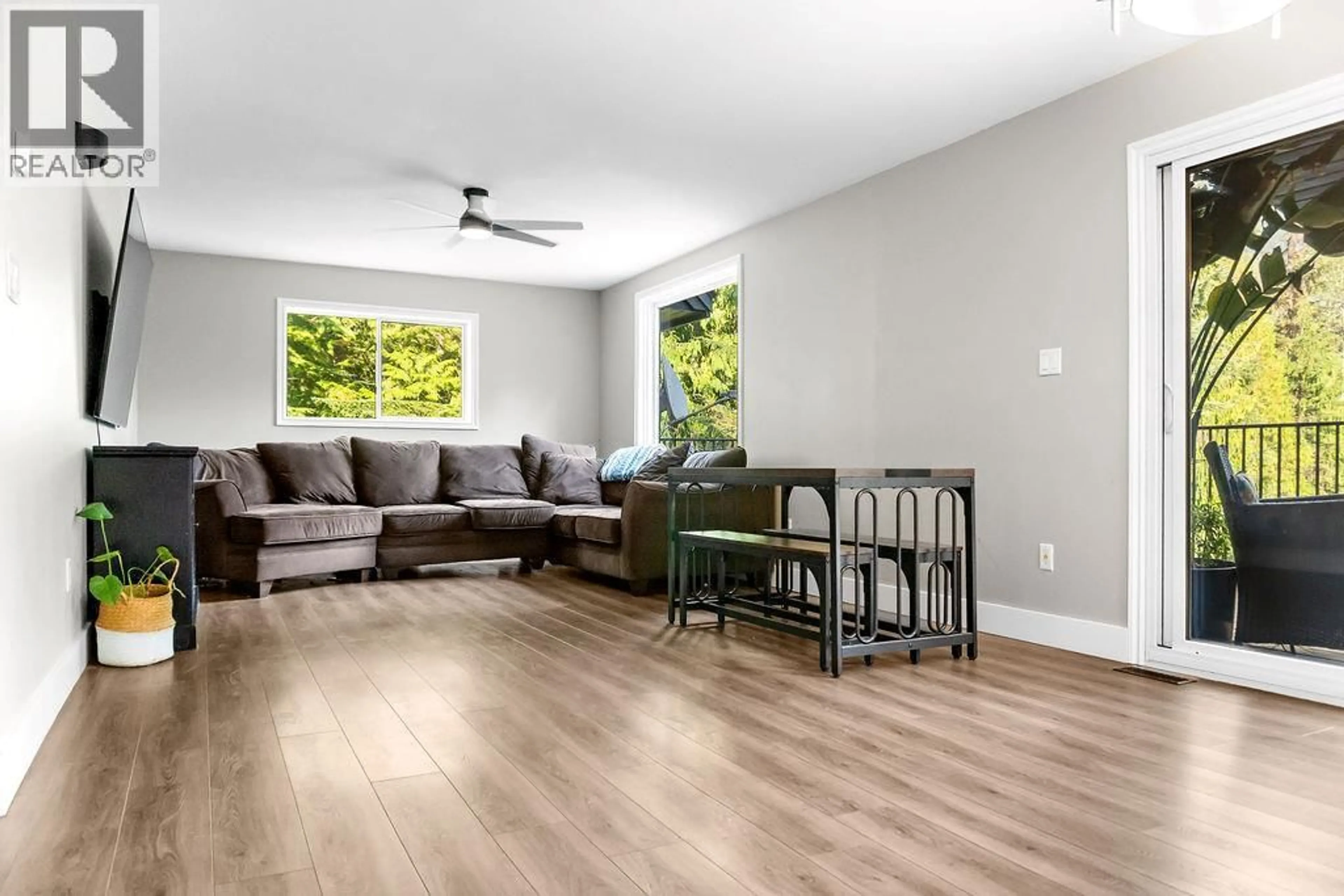 Living room with furniture, wood/laminate floor for 2227 ALLSHOUSE ROAD, Summit Lake British Columbia V0G1R1