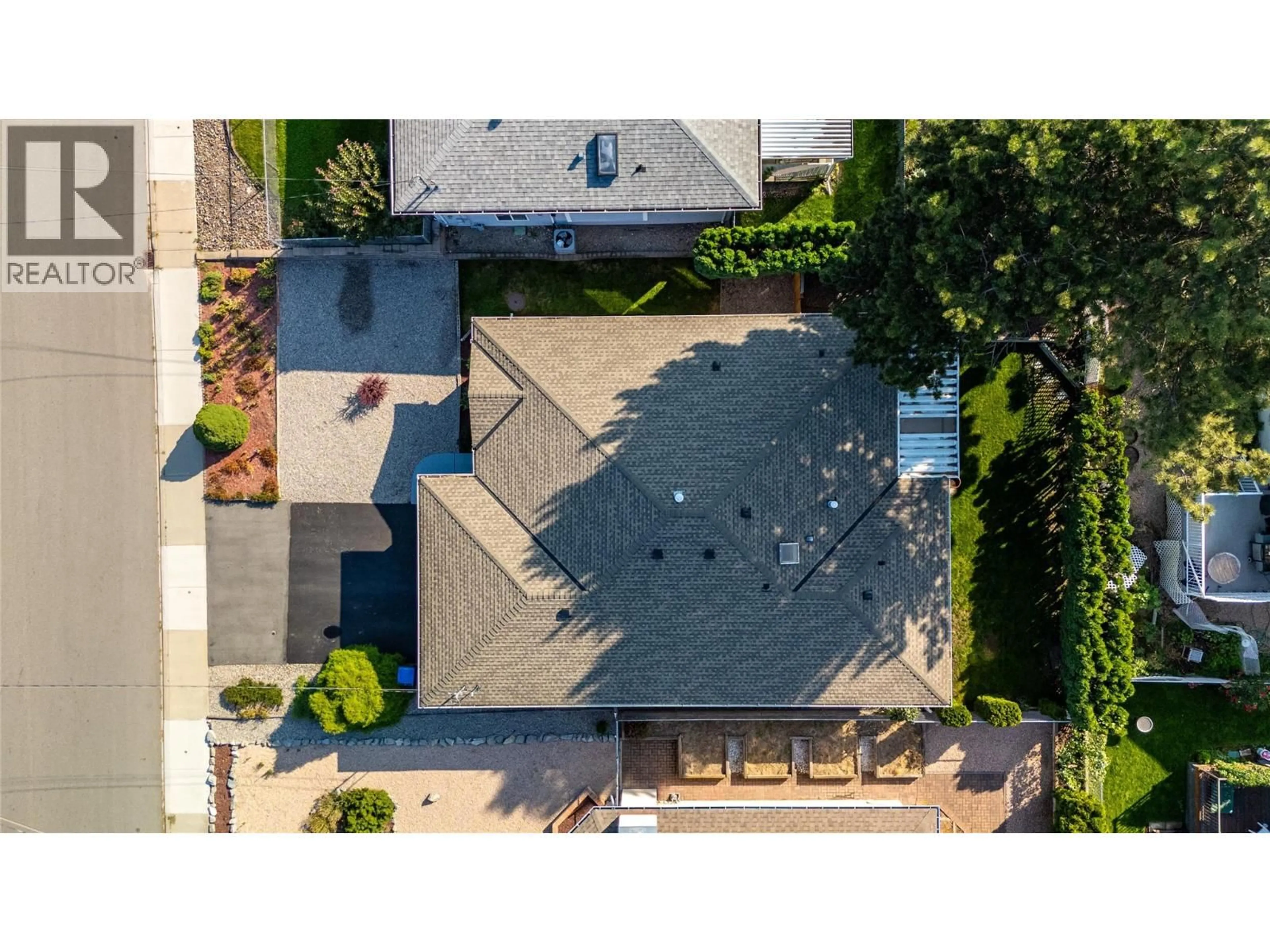 A pic from outside/outdoor area/front of a property/back of a property/a pic from drone, street for 138 OKANAGAN AVENUE WEST, Penticton British Columbia V2A3L1