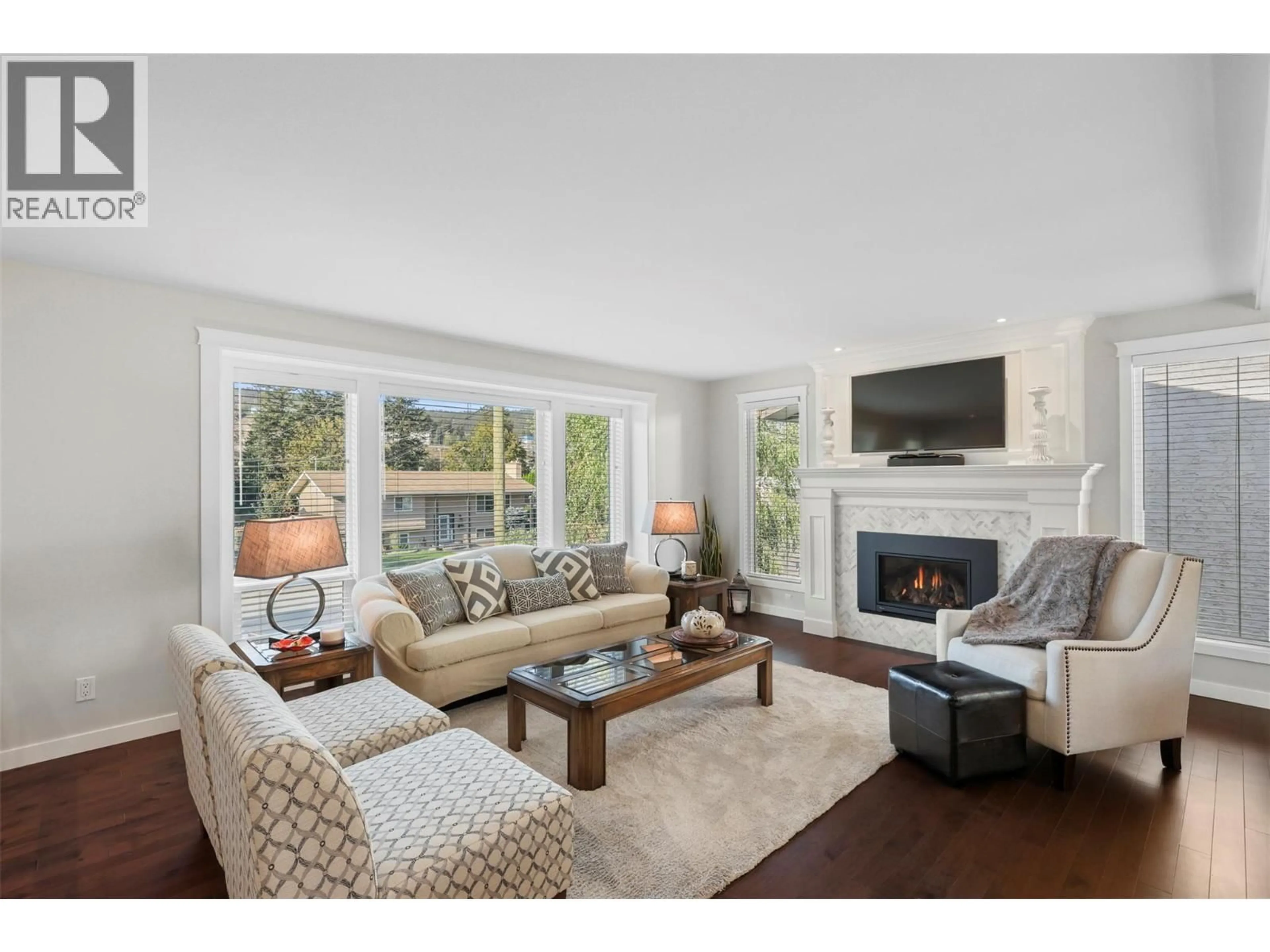 Living room with furniture, wood/laminate floor for 1726 HILLSIDE DRIVE, Kamloops British Columbia V2E1N4