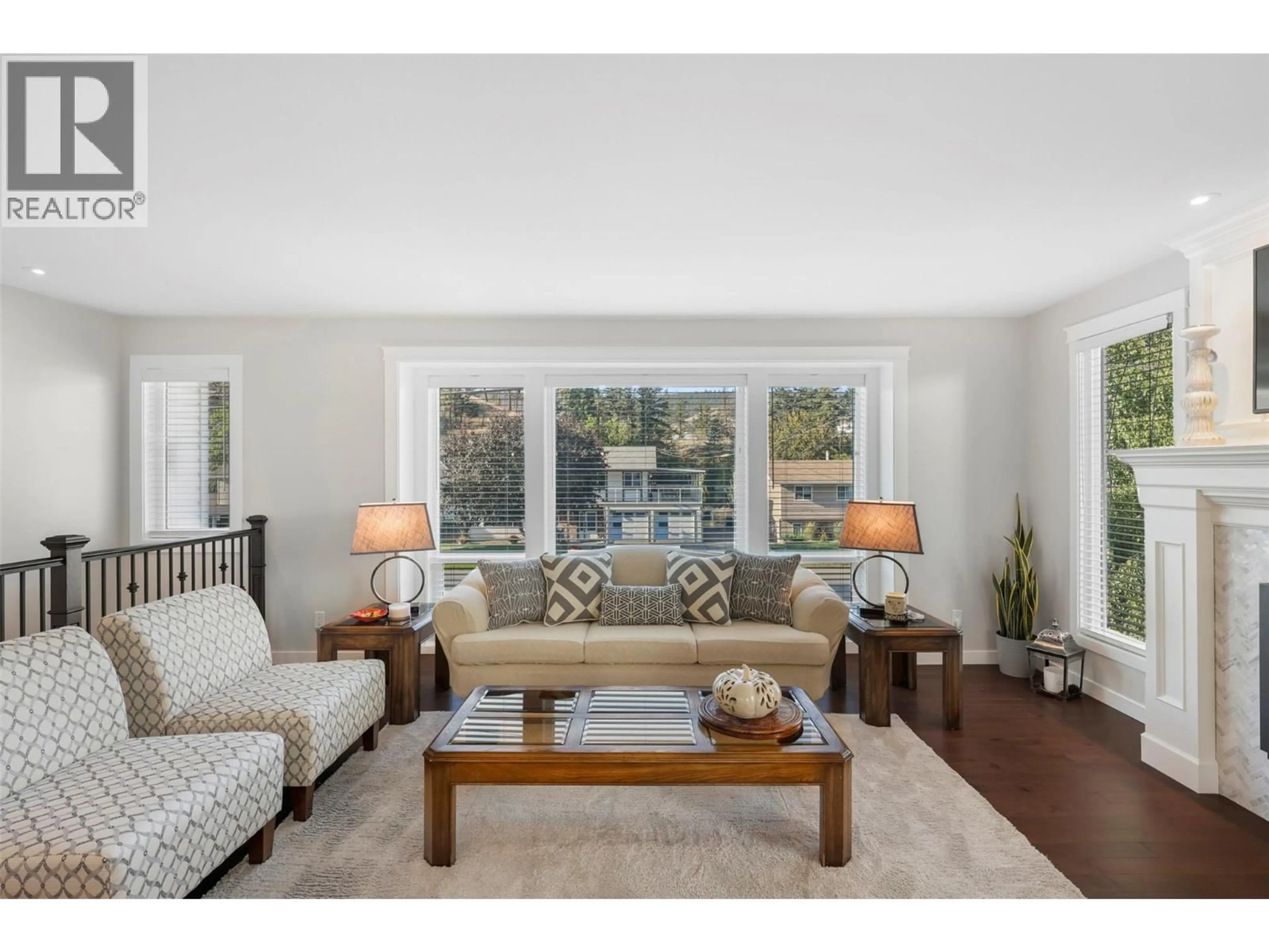 Living room with furniture, wood/laminate floor for 1726 HILLSIDE DRIVE, Kamloops British Columbia V2E1N4