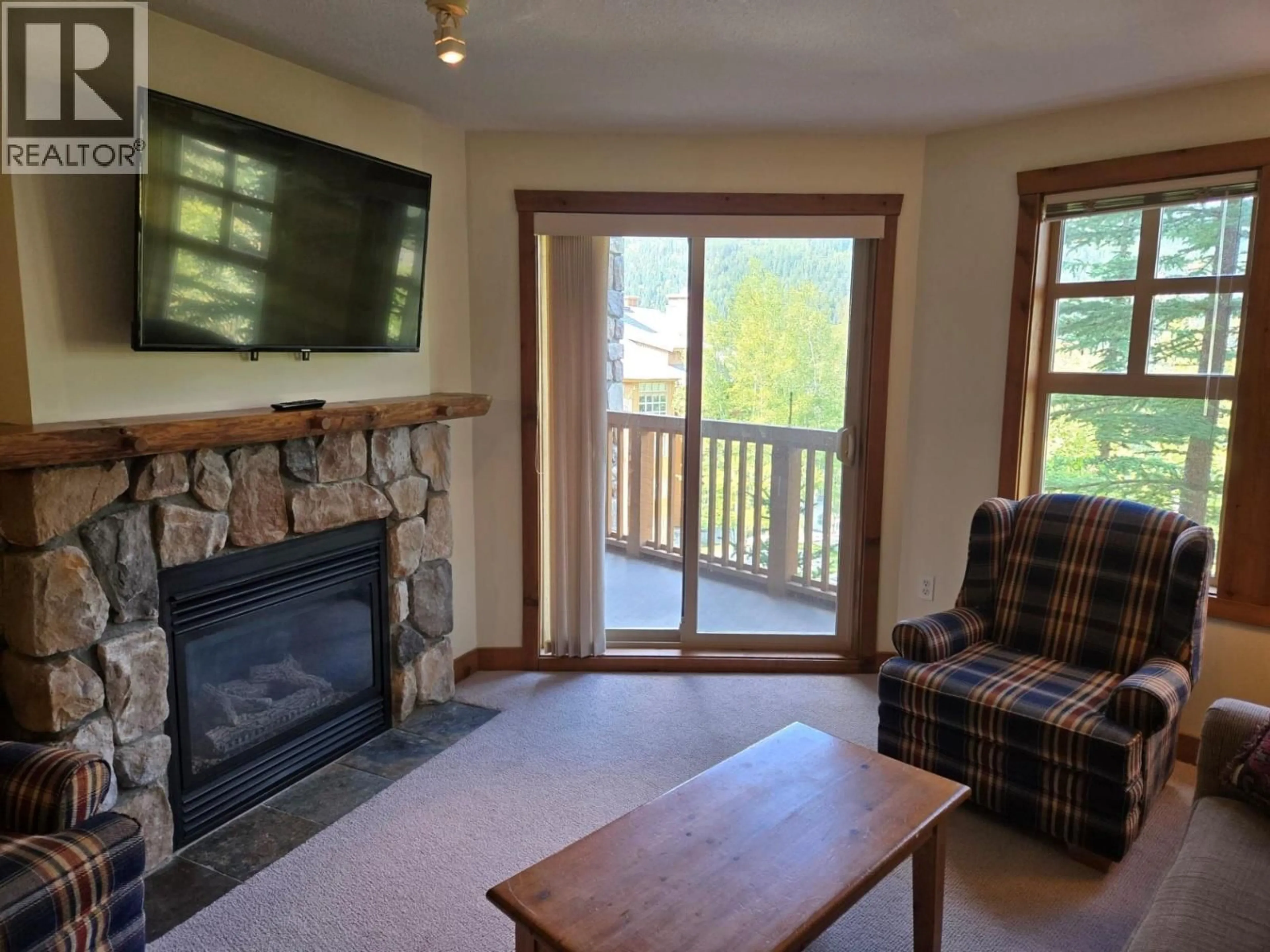Living room with furniture, wood/laminate floor for 308 - 2090 SUMMIT DRIVE, Panorama British Columbia V0A1T0