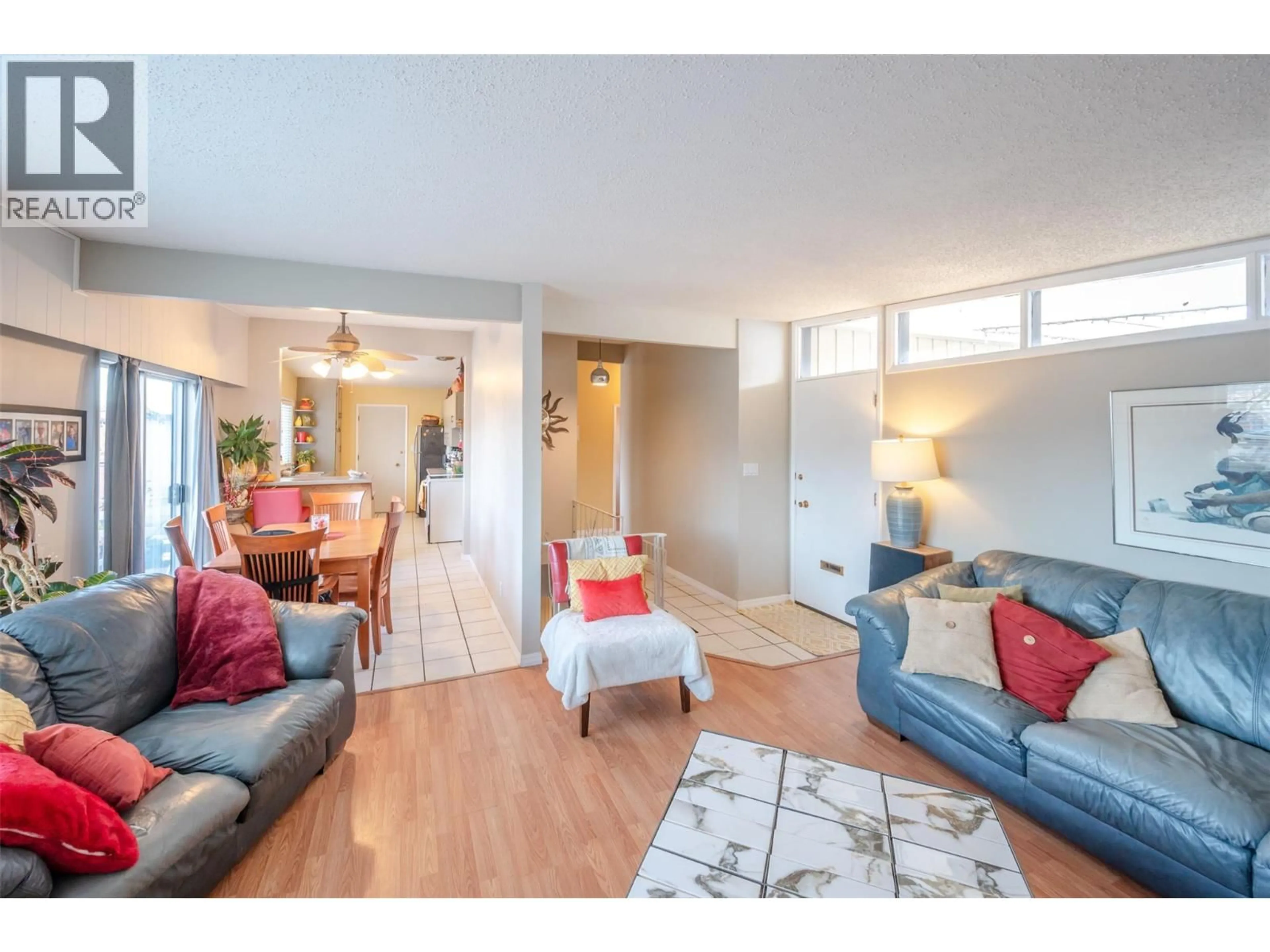 Living room with furniture, wood/laminate floor for 1467 CARMI DRIVE, Penticton British Columbia V2A4R9