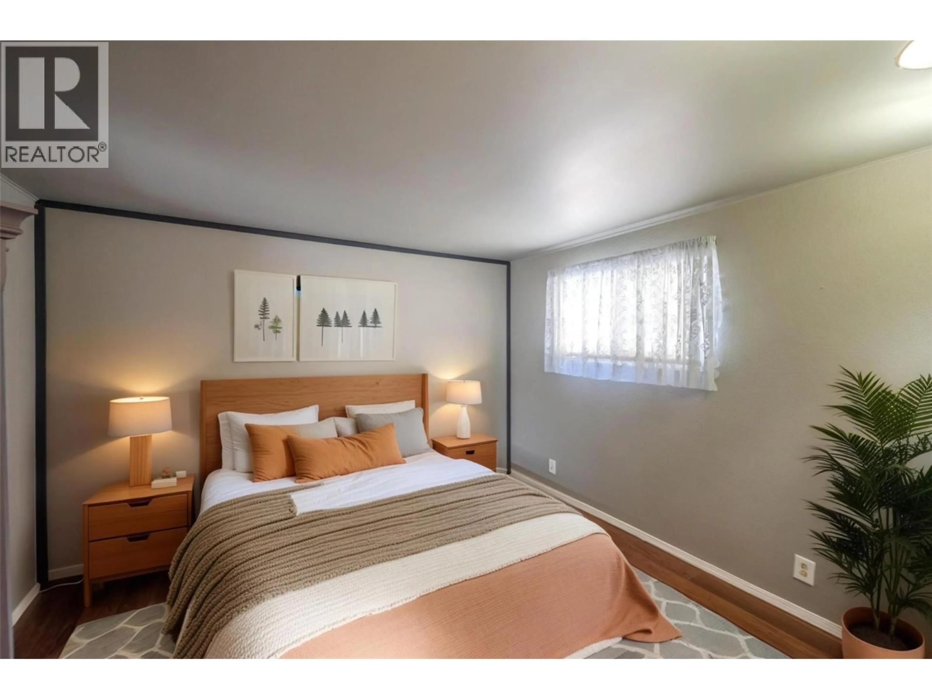 Bedroom with bed, wood/laminate floor for E8 - 4505 MCLEAN CREEK ROAD, Okanagan Falls British Columbia V0H1R1