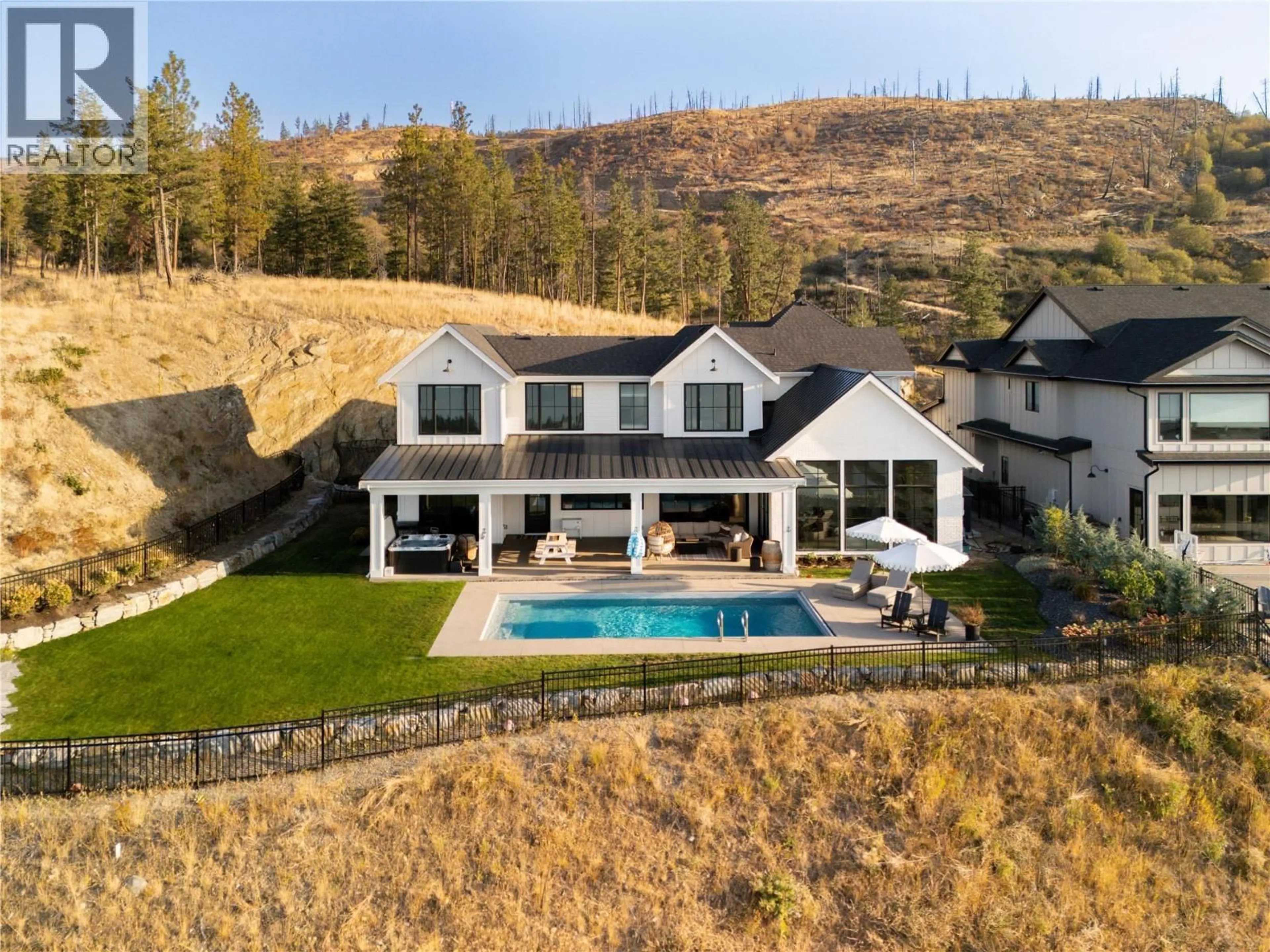 A pic from outside/outdoor area/front of a property/back of a property/a pic from drone, mountain view for 5635 UPPER MISSION COURT, Kelowna British Columbia V1W0C5