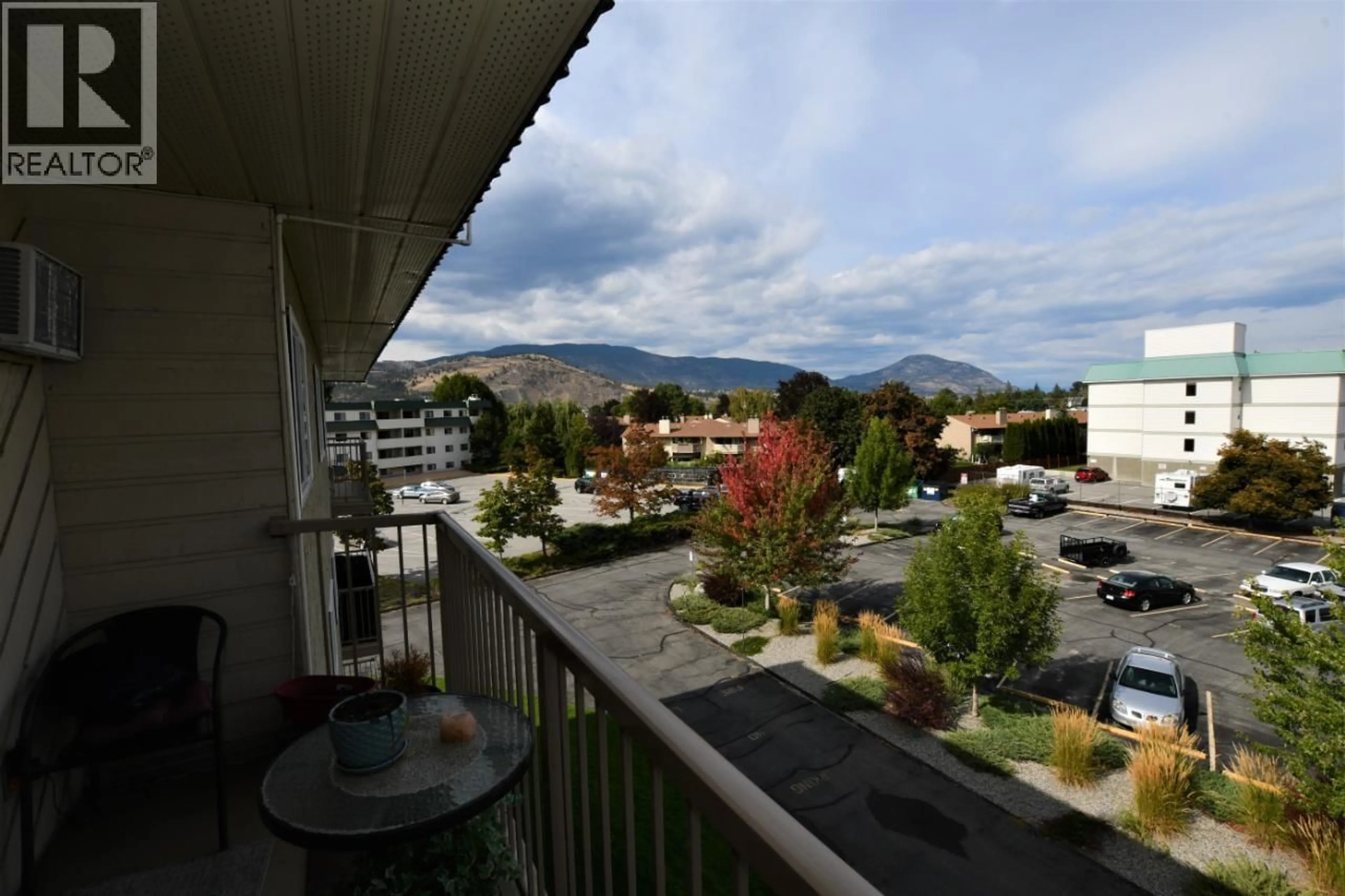 Patio, mountain view for 406 - 130 SKAHA PLACE, Penticton British Columbia V2A7J6