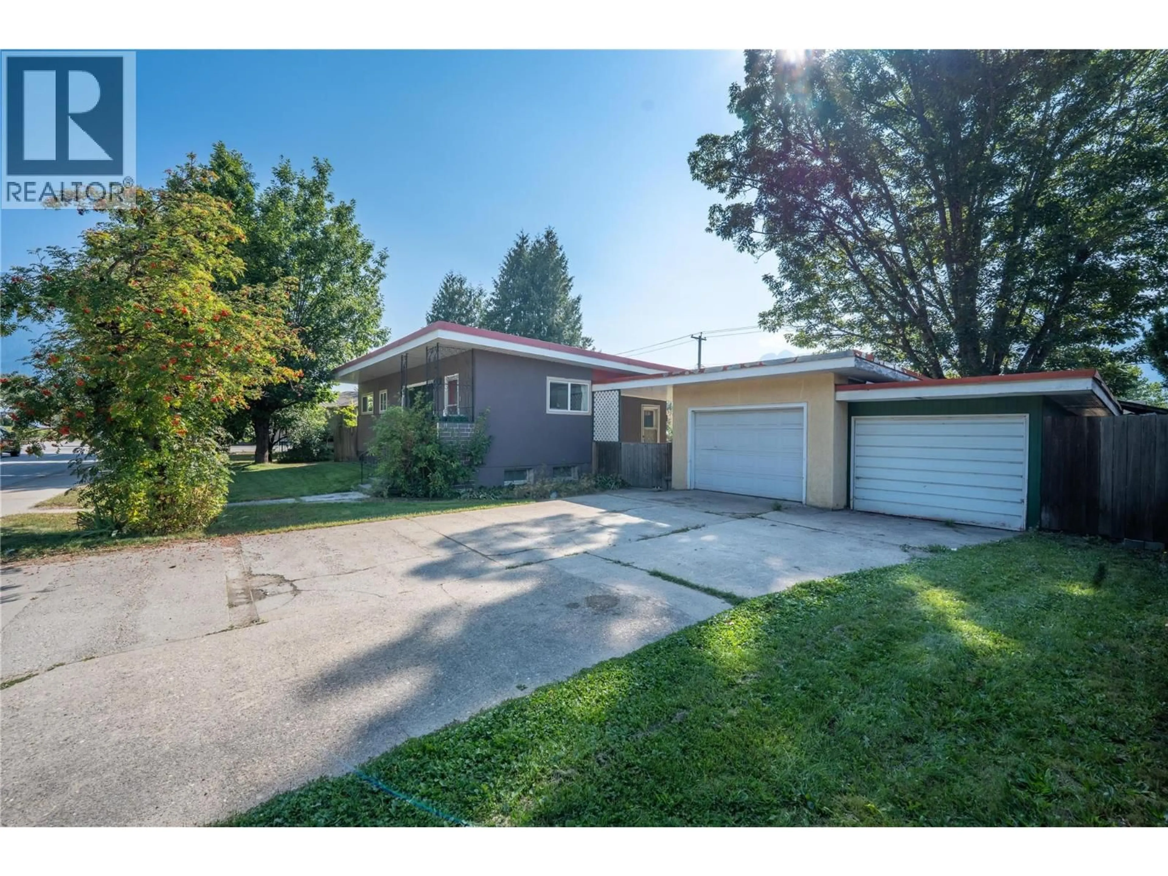 A pic from outside/outdoor area/front of a property/back of a property/a pic from drone, street for 1003 VICTORIA ROAD, Revelstoke British Columbia V0E2S0