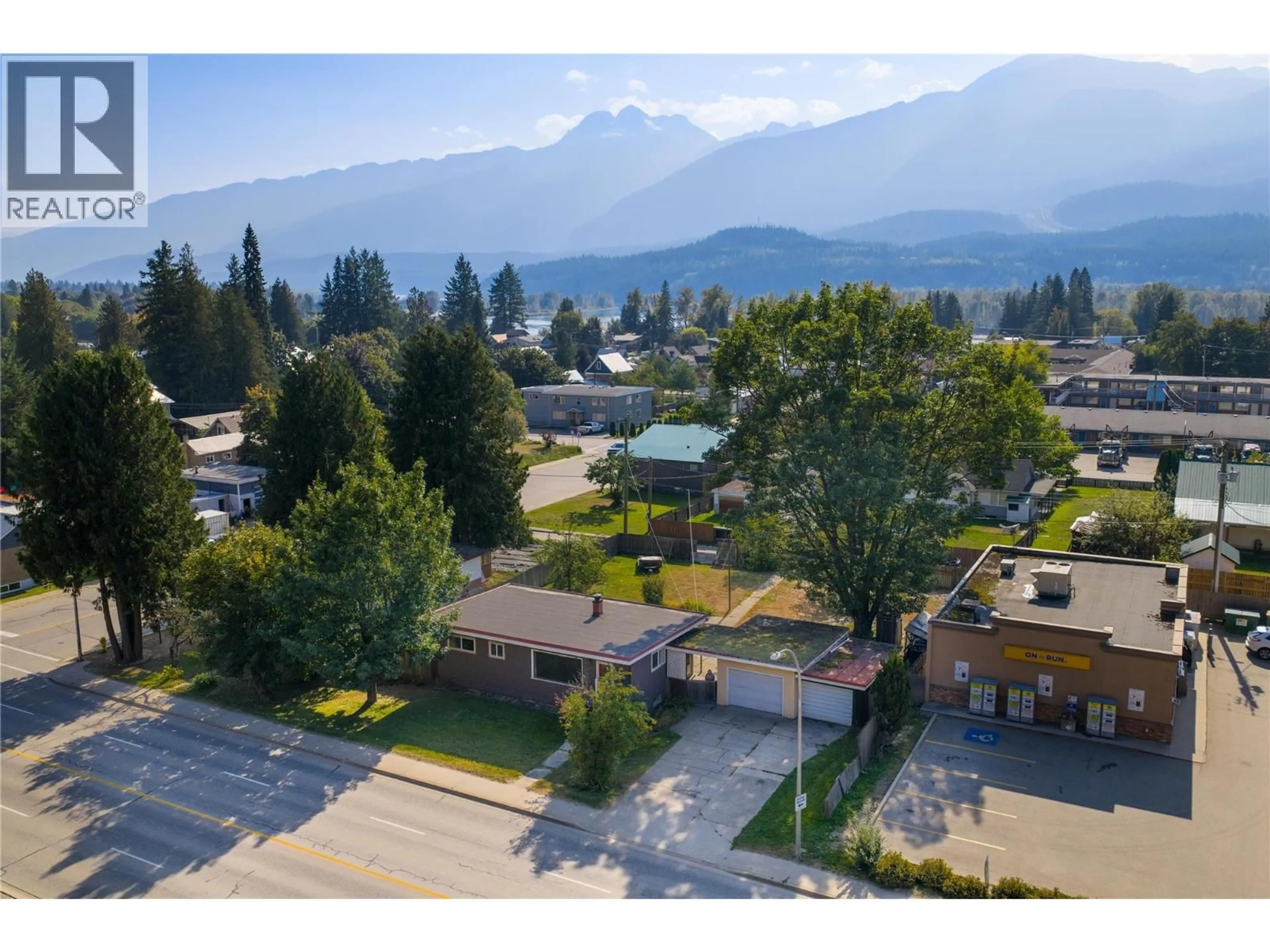 A pic from outside/outdoor area/front of a property/back of a property/a pic from drone, mountain view for 1003 VICTORIA ROAD, Revelstoke British Columbia V0E2S0