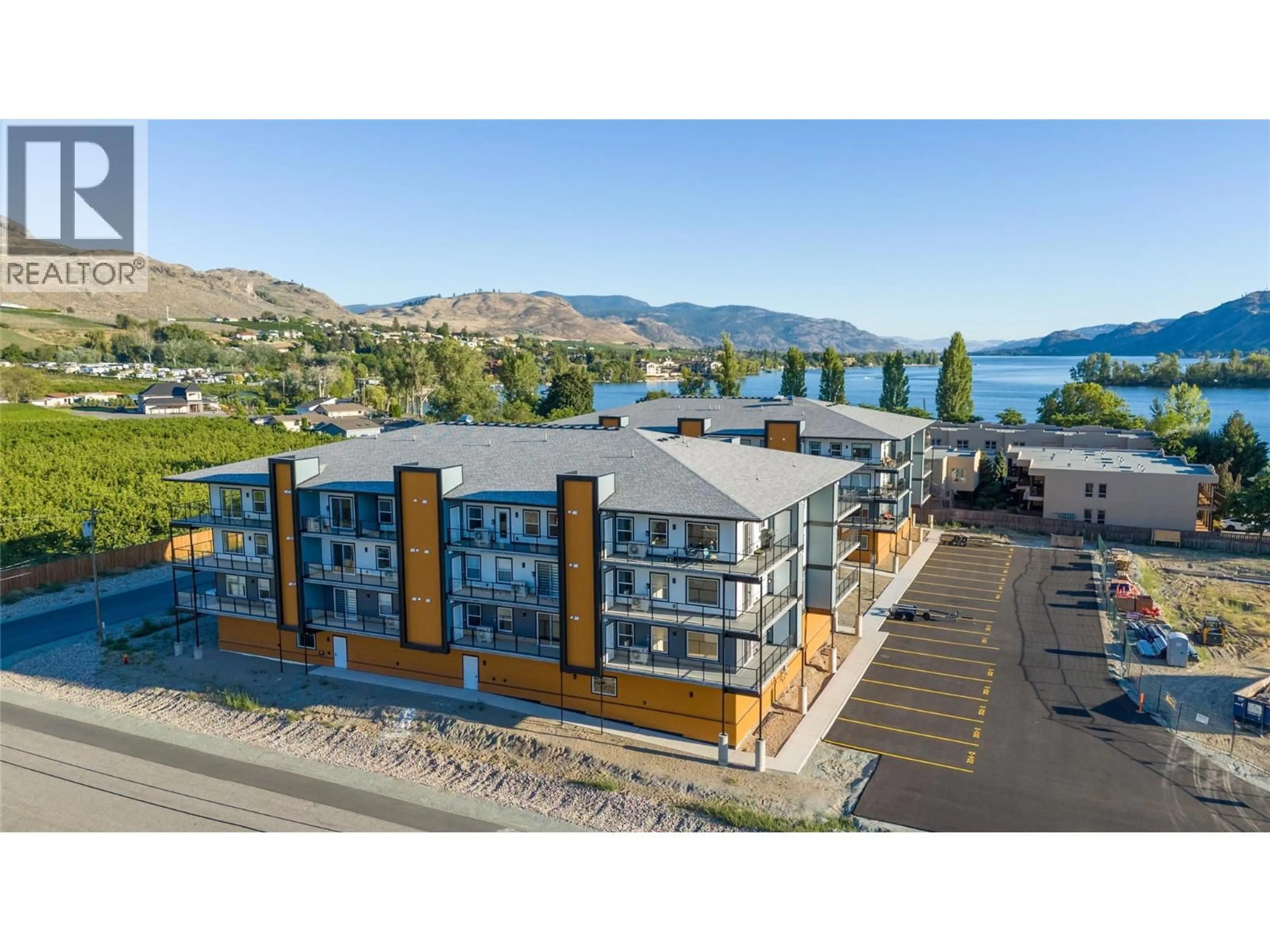 A pic from outside/outdoor area/front of a property/back of a property/a pic from drone, water/lake/river/ocean view for 404 - 5620 51ST STREET, Osoyoos British Columbia V0H1V6