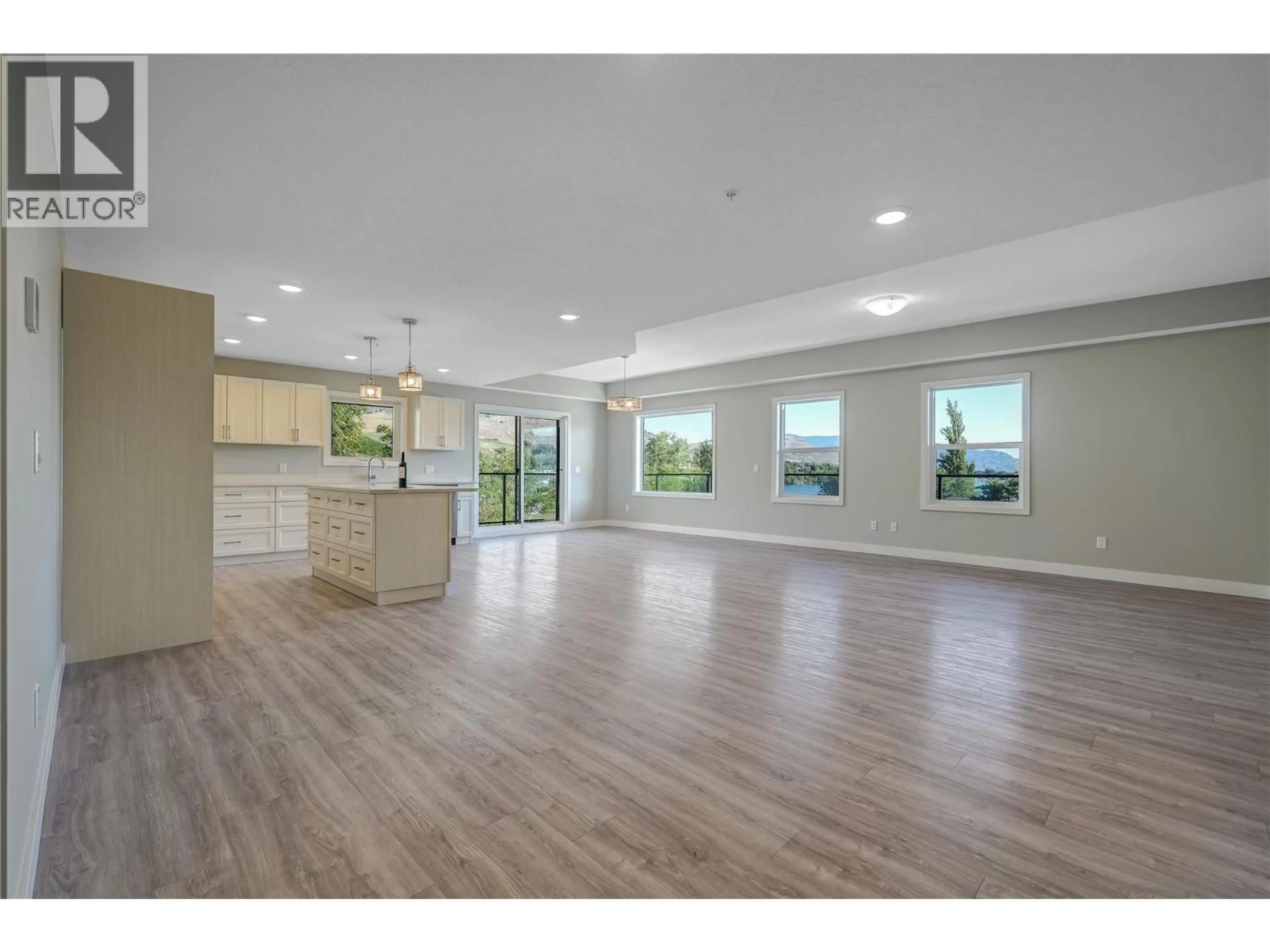 Open concept kitchen, wood/laminate floor for 404 - 5620 51ST STREET, Osoyoos British Columbia V0H1V6