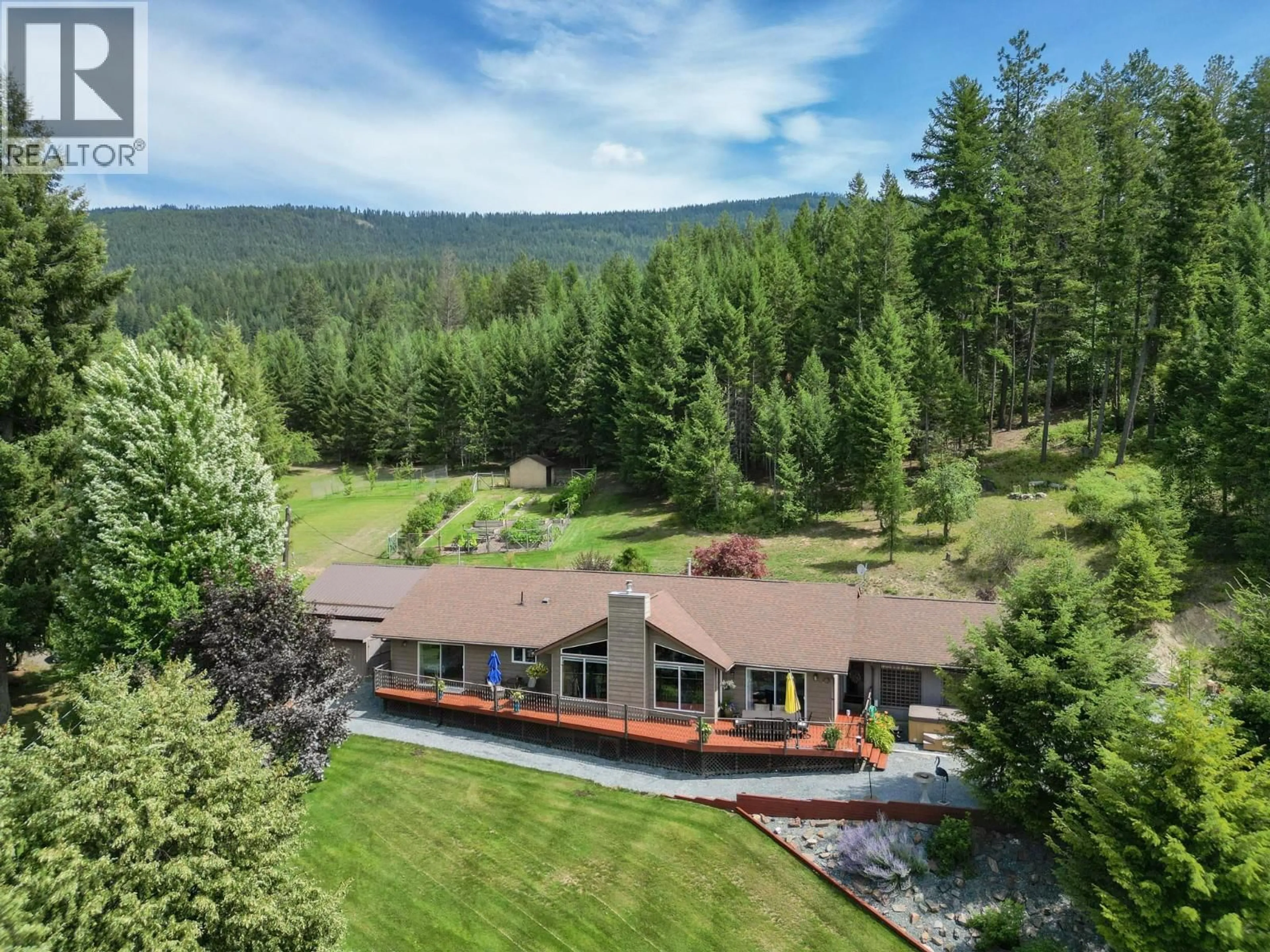 A pic from outside/outdoor area/front of a property/back of a property/a pic from drone, mountain view for 5126 BOSSIO ROAD, Wynndel British Columbia V0B2N1