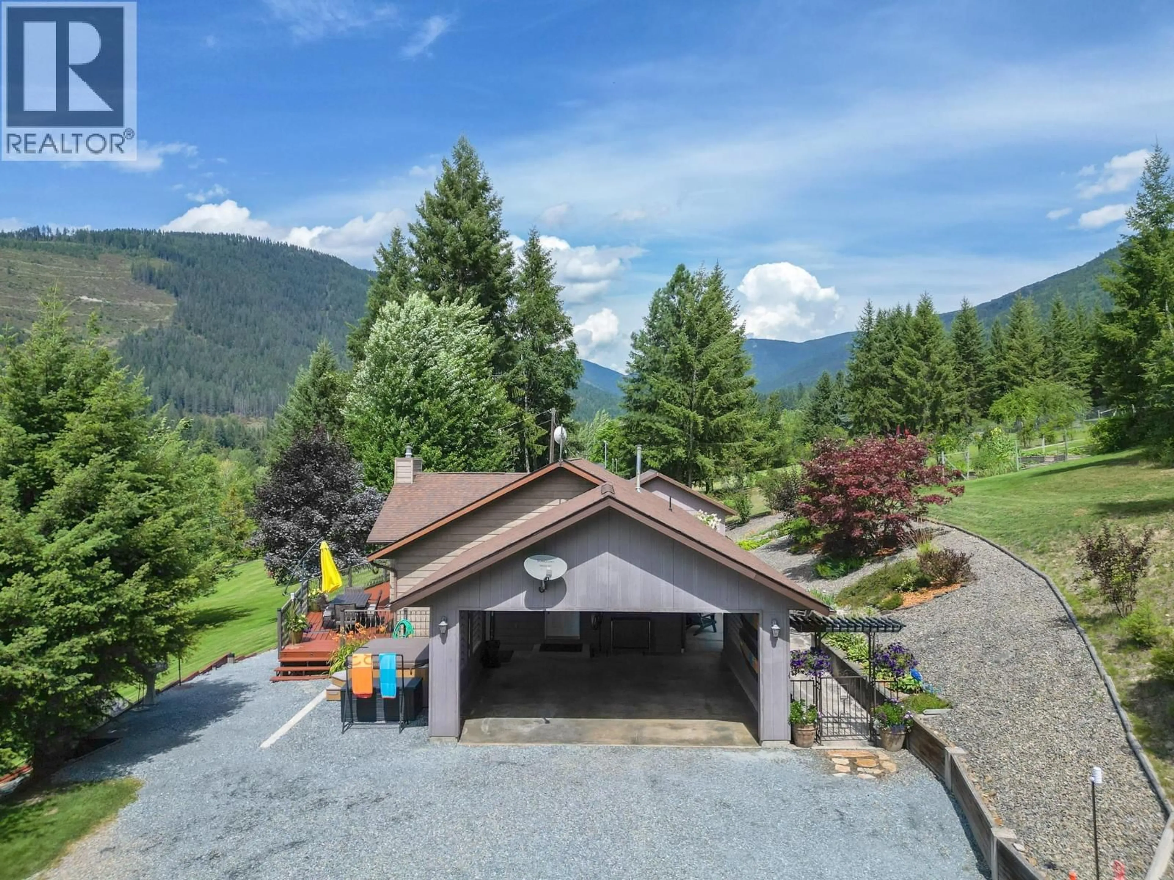 A pic from outside/outdoor area/front of a property/back of a property/a pic from drone, mountain view for 5126 BOSSIO ROAD, Wynndel British Columbia V0B2N1