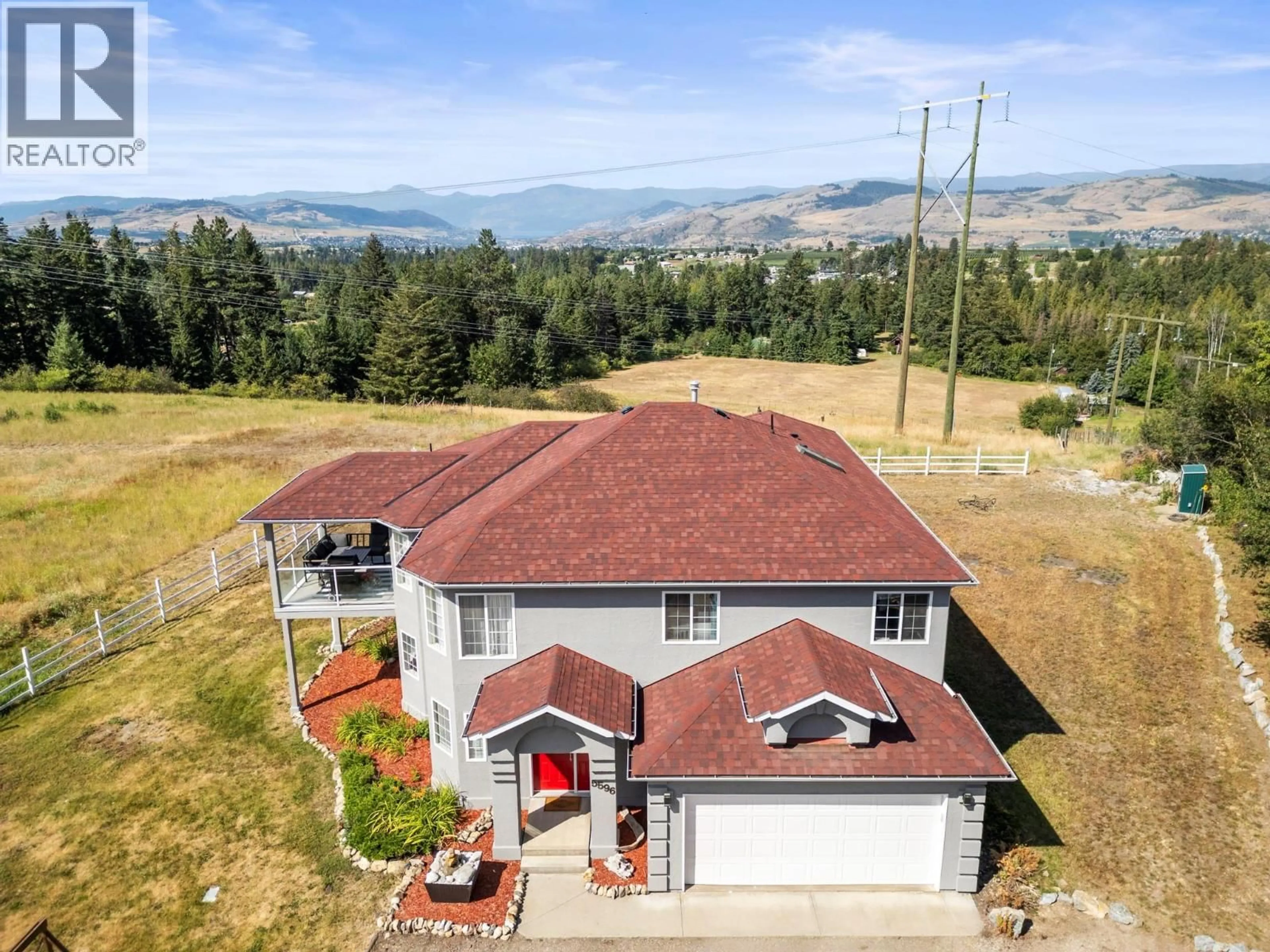 A pic from outside/outdoor area/front of a property/back of a property/a pic from drone, mountain view for 5596 CURLEW ROAD, Vernon British Columbia V1B3J8