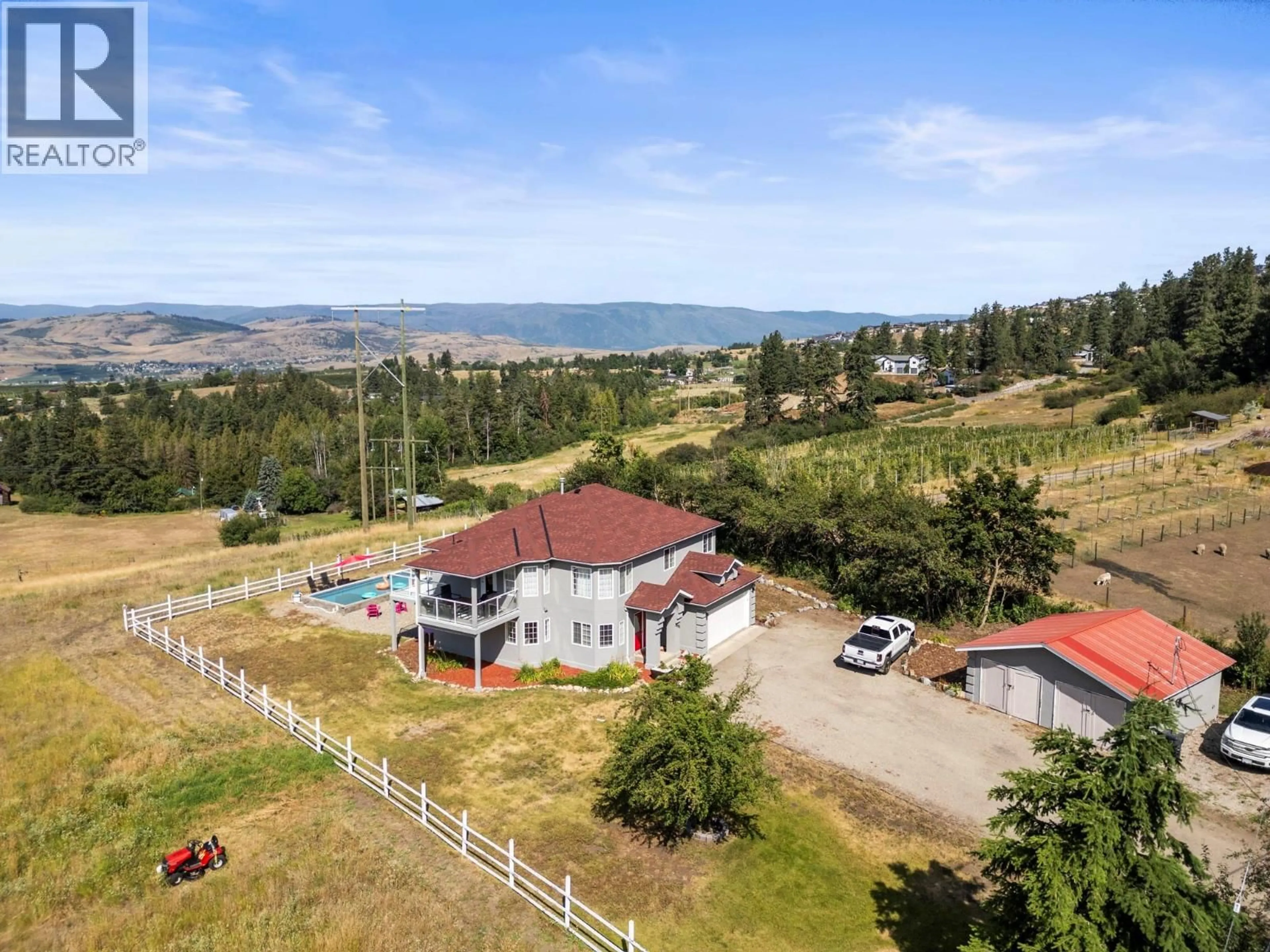 A pic from outside/outdoor area/front of a property/back of a property/a pic from drone, water/lake/river/ocean view for 5596 CURLEW ROAD, Vernon British Columbia V1B3J8