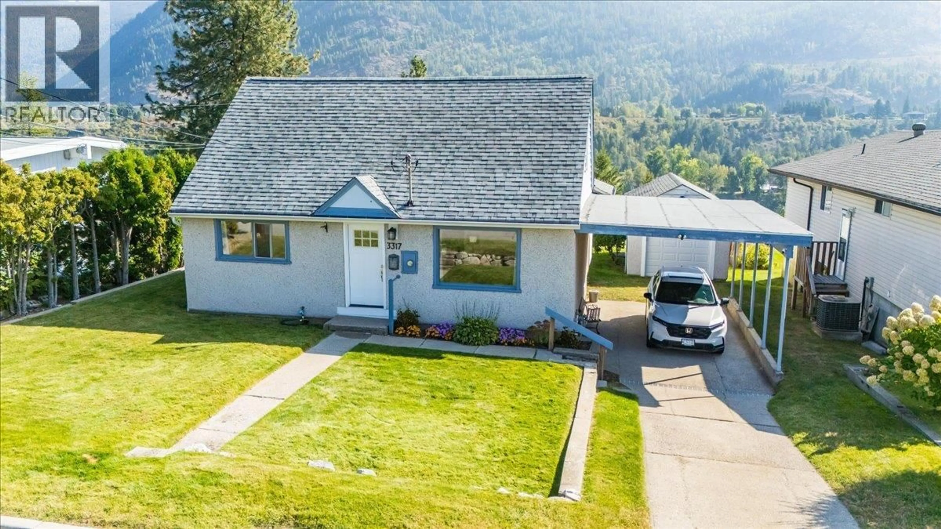 A pic from outside/outdoor area/front of a property/back of a property/a pic from drone, mountain view for 3317 3RD AVENUE, Castlegar British Columbia V1N2R5