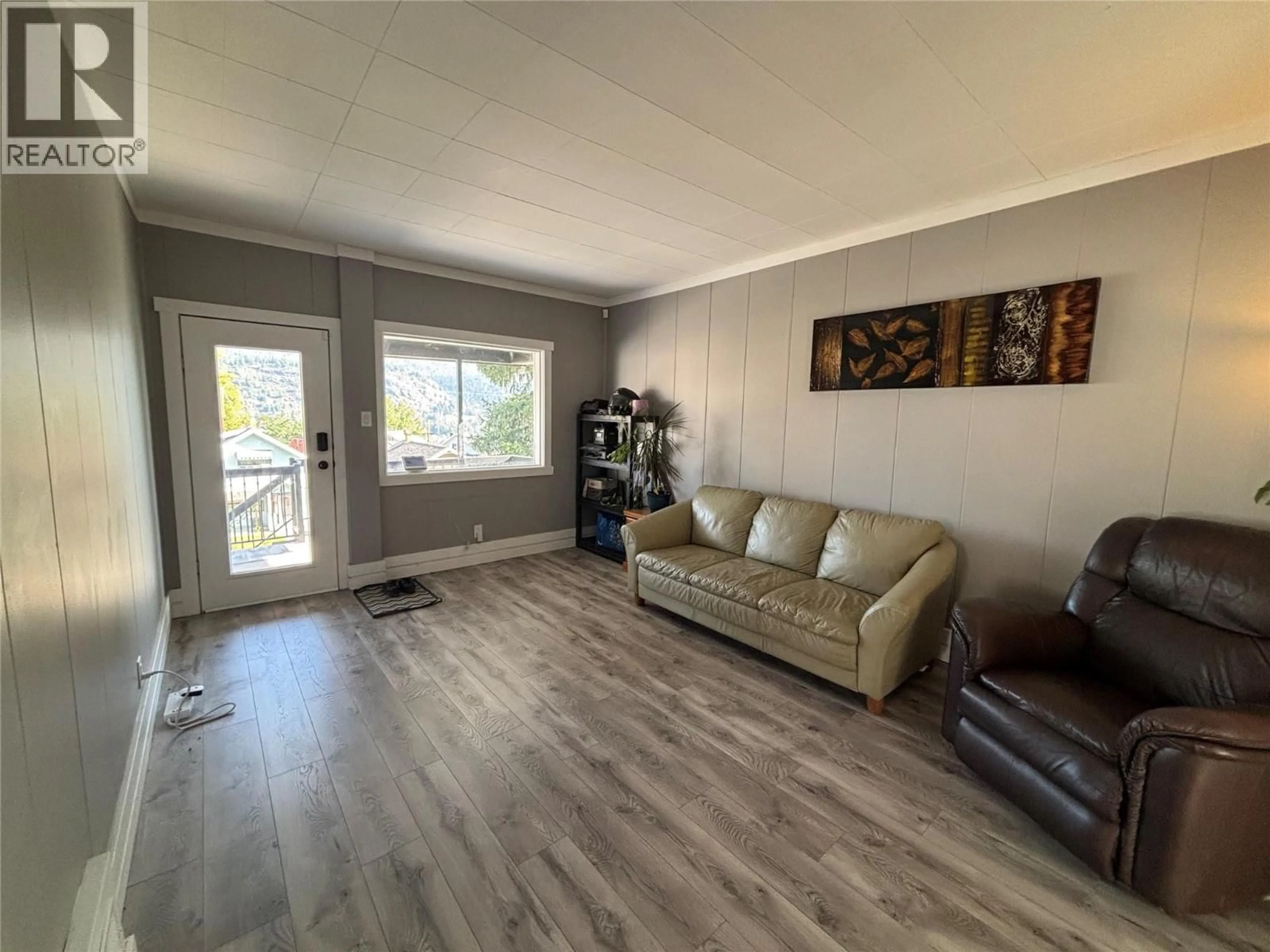 Living room with furniture, wood/laminate floor for 1170 NELSON AVENUE, Trail British Columbia V1R3H5