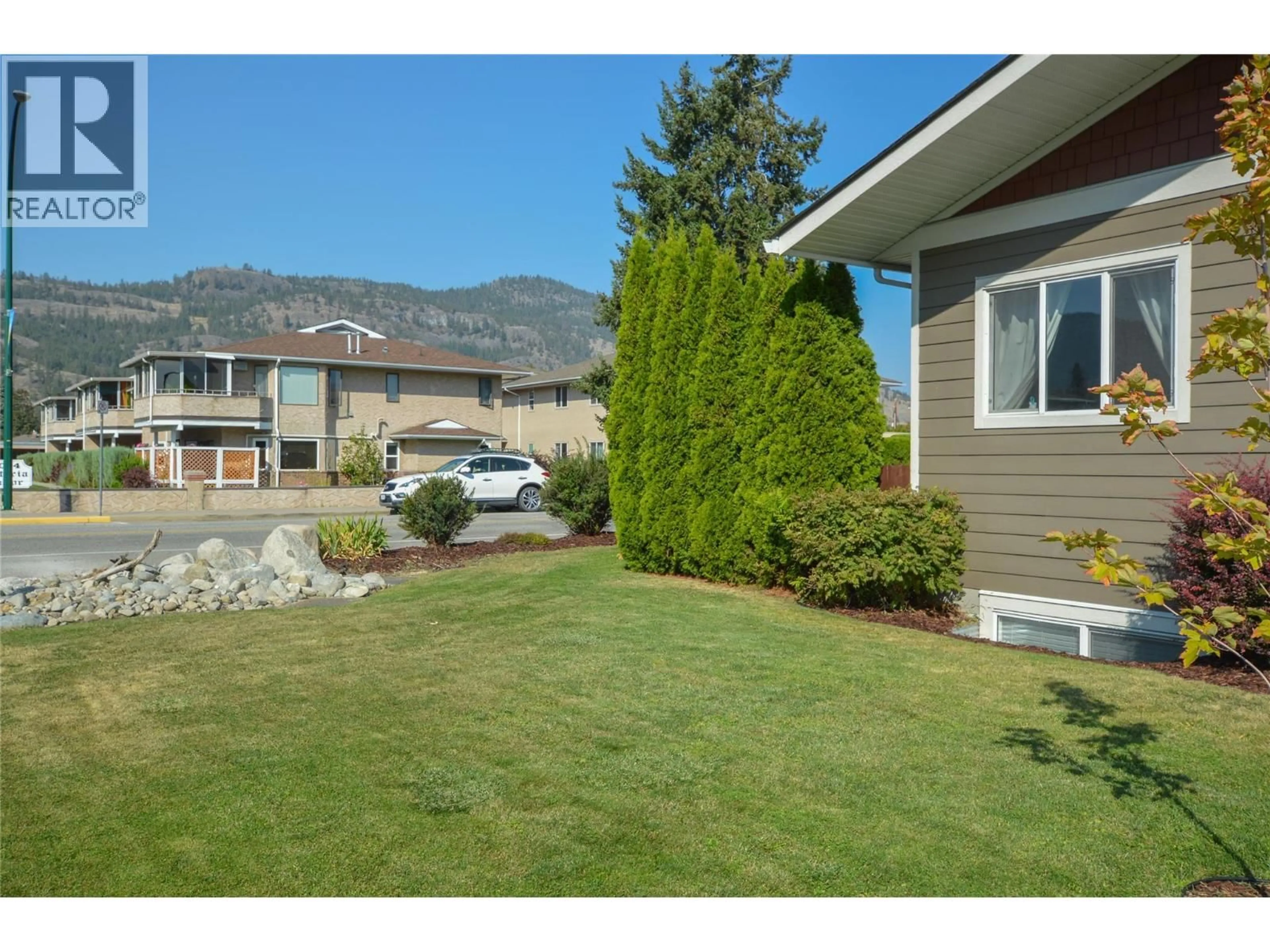 Home with vinyl exterior material, mountain view for 10126 RAND STREET, Summerland British Columbia V0H1Z5