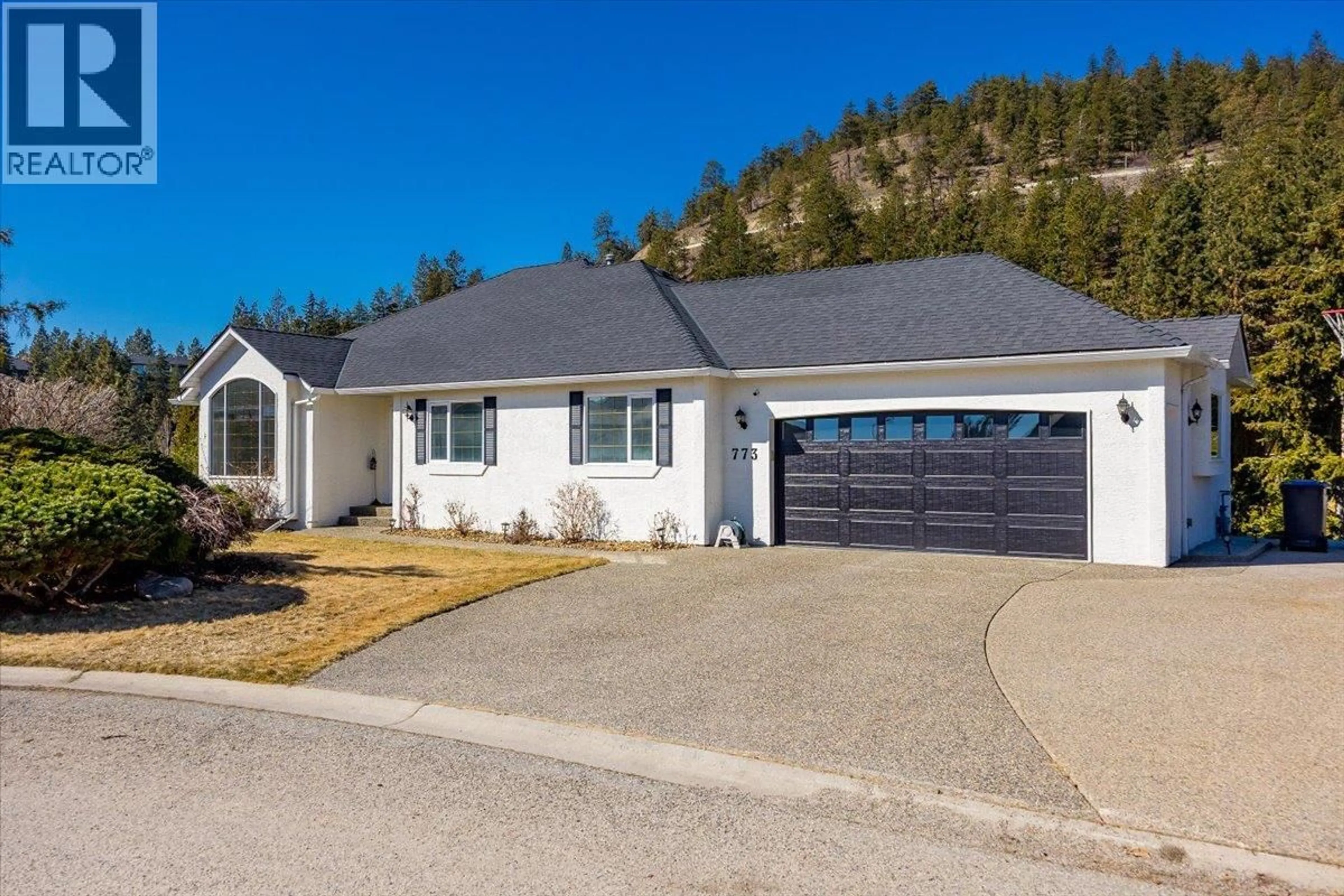 Home with vinyl exterior material, street for 773 SIWASH COURT, Kelowna British Columbia V1V1N5
