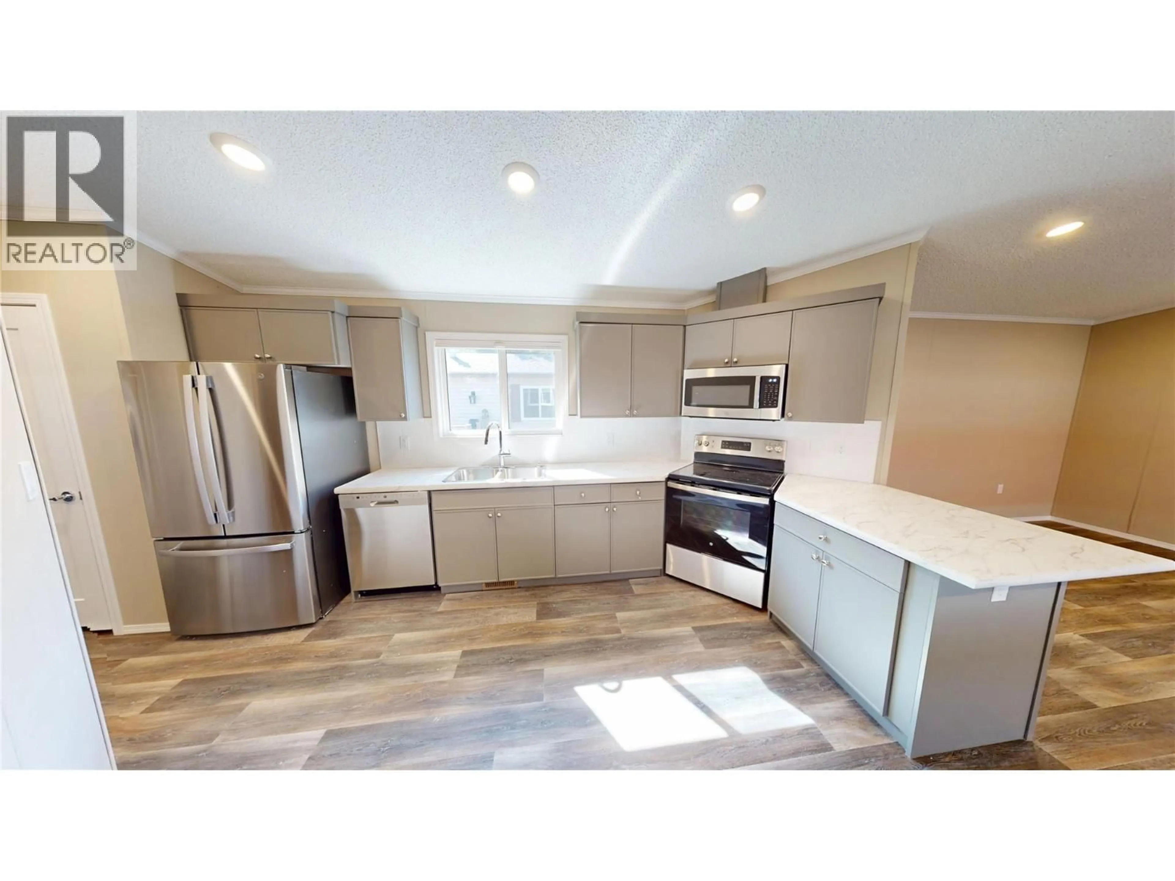 Open concept kitchen, ceramic/tile floor for 63 - 100 ASPEN DRIVE, Sparwood British Columbia V0B2G0