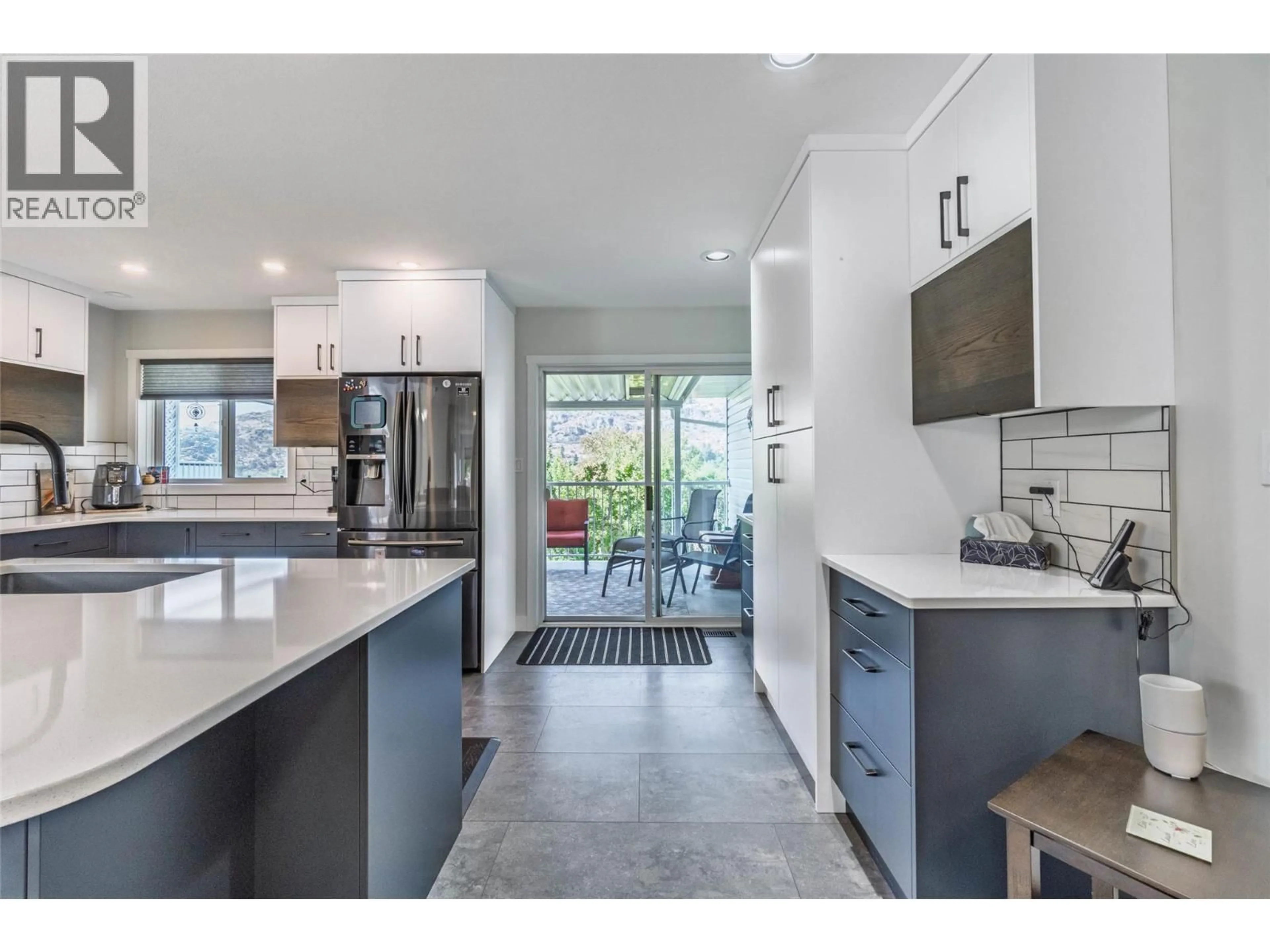 Open concept kitchen, ceramic/tile floor for 323 RIESLING PLACE, Oliver British Columbia V0H1T4
