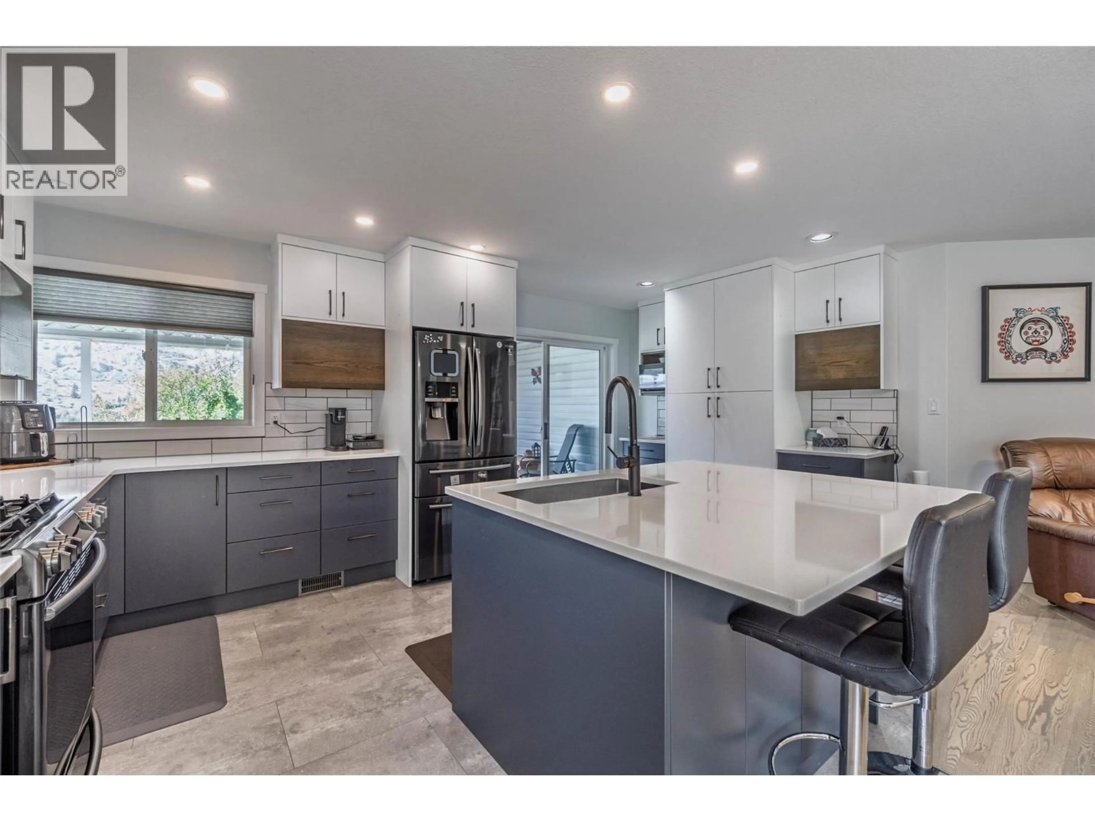 Open concept kitchen, ceramic/tile floor for 323 RIESLING PLACE, Oliver British Columbia V0H1T4