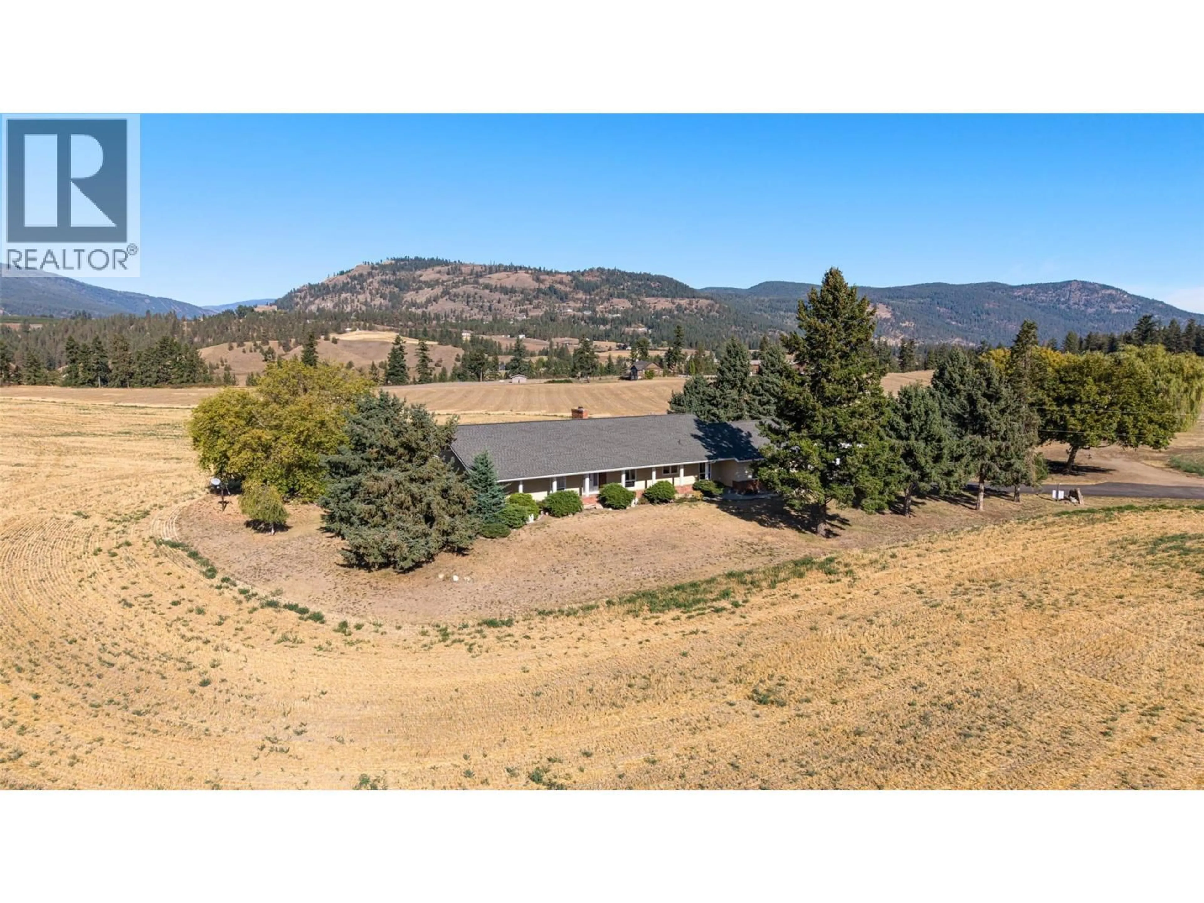 A pic from outside/outdoor area/front of a property/back of a property/a pic from drone, mountain view for 683 CLINTON ROAD, Spallumcheen British Columbia V4Y0P3