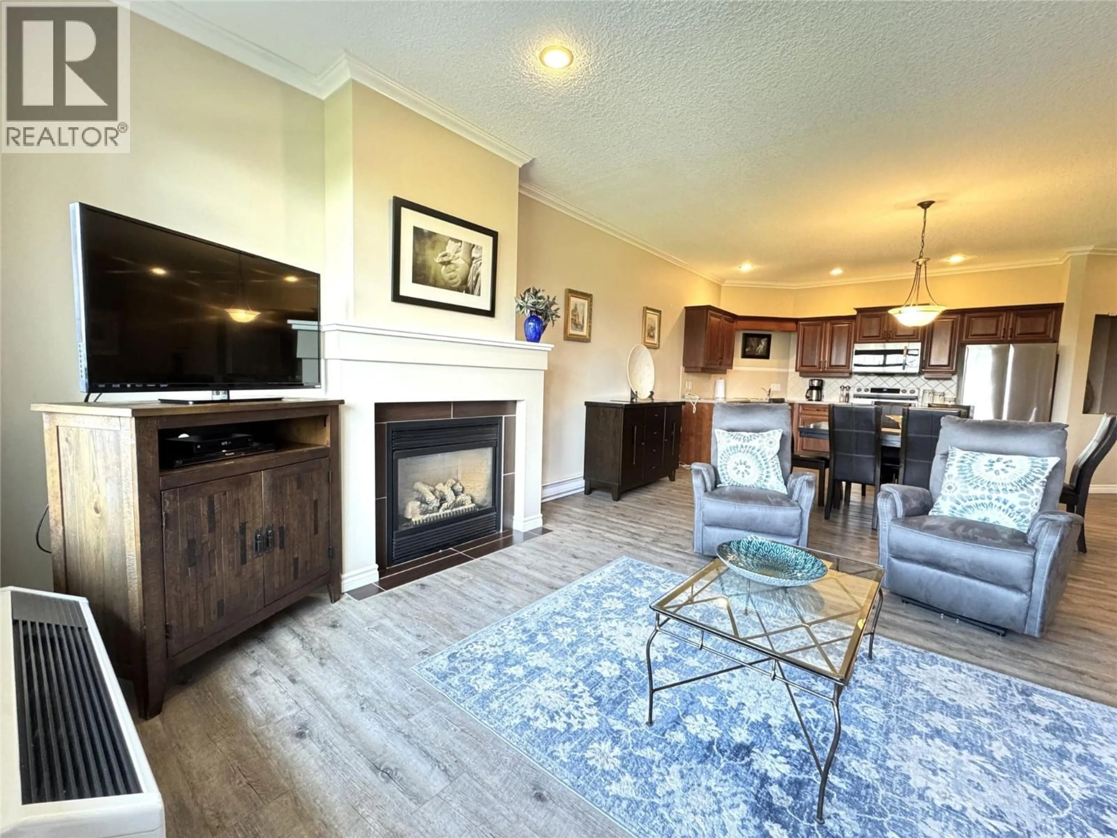 Living room with furniture, wood/laminate floor for 113 - 100 BIGHORN BOULEVARD, Radium Hot Springs British Columbia V0A1M0