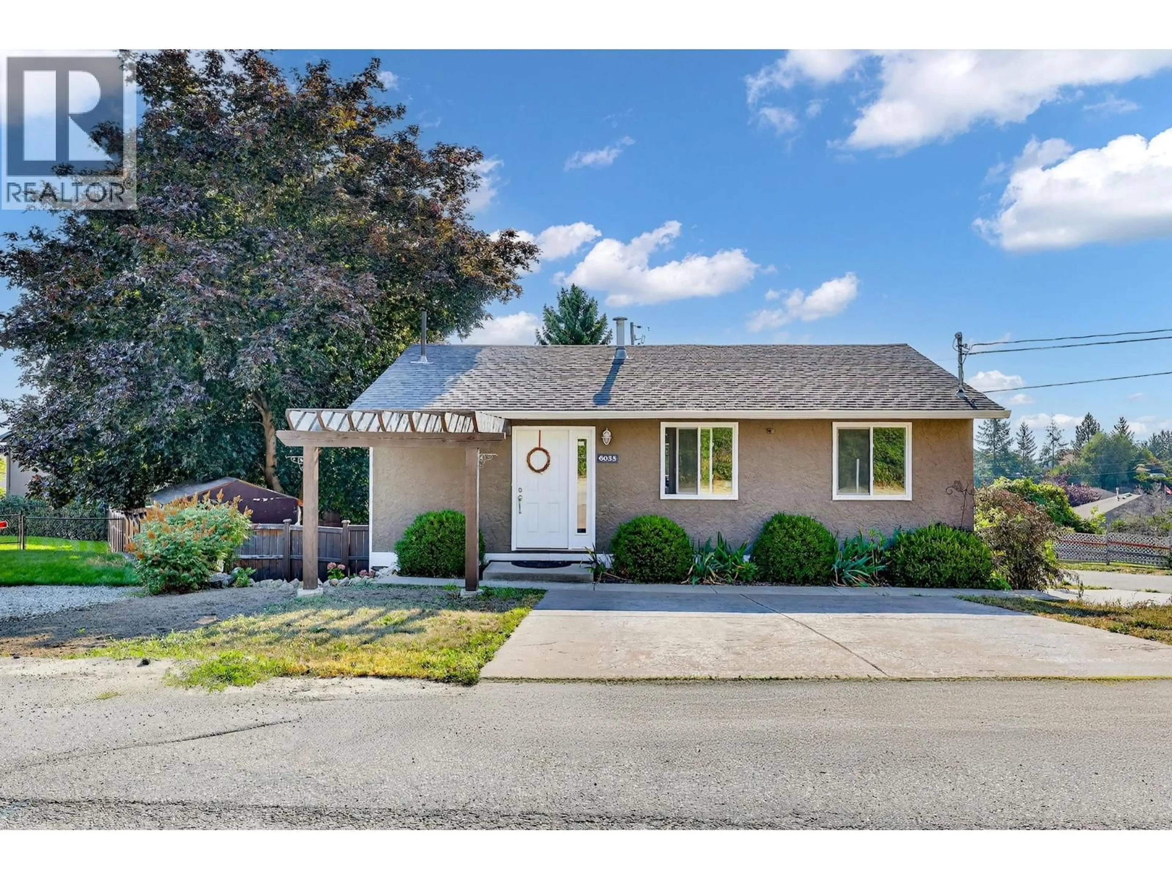 Home with vinyl exterior material, street for 6035 TURNER AVENUE, Peachland British Columbia V0H1X4