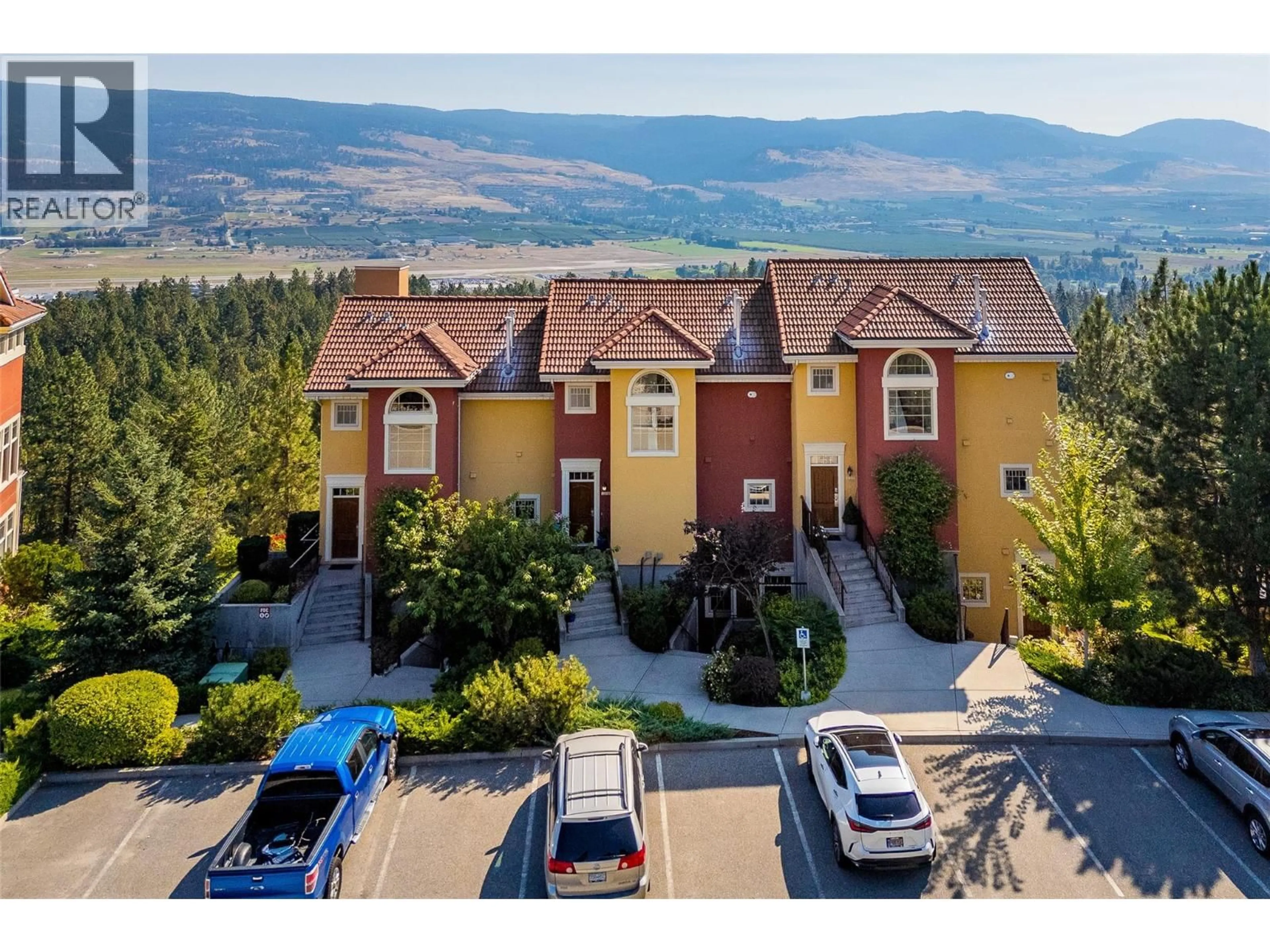 A pic from outside/outdoor area/front of a property/back of a property/a pic from drone, mountain view for 216 - 1795 COUNTRY CLUB DRIVE, Kelowna British Columbia V1Y9K8
