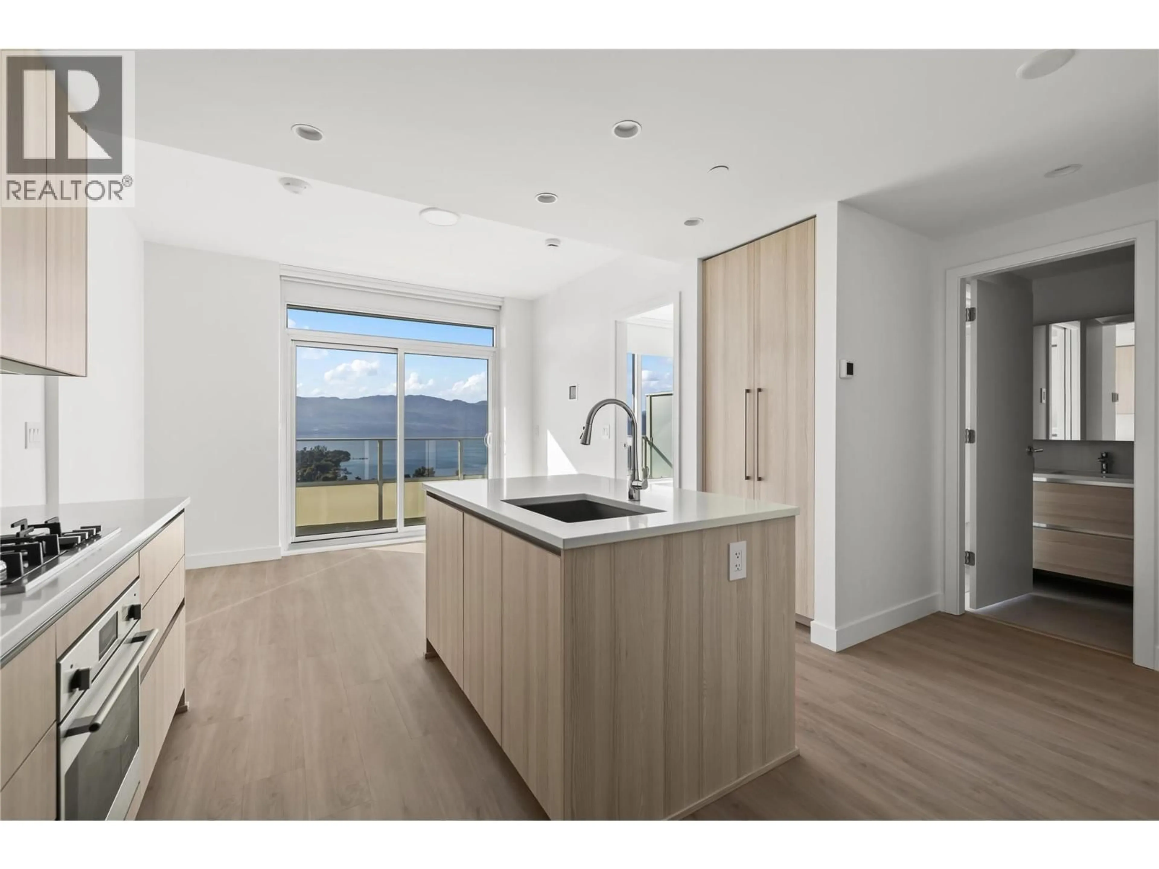 Open concept kitchen, wood/laminate floor for 2705 - 1626 WATER STREET, Kelowna British Columbia V1Y1J9