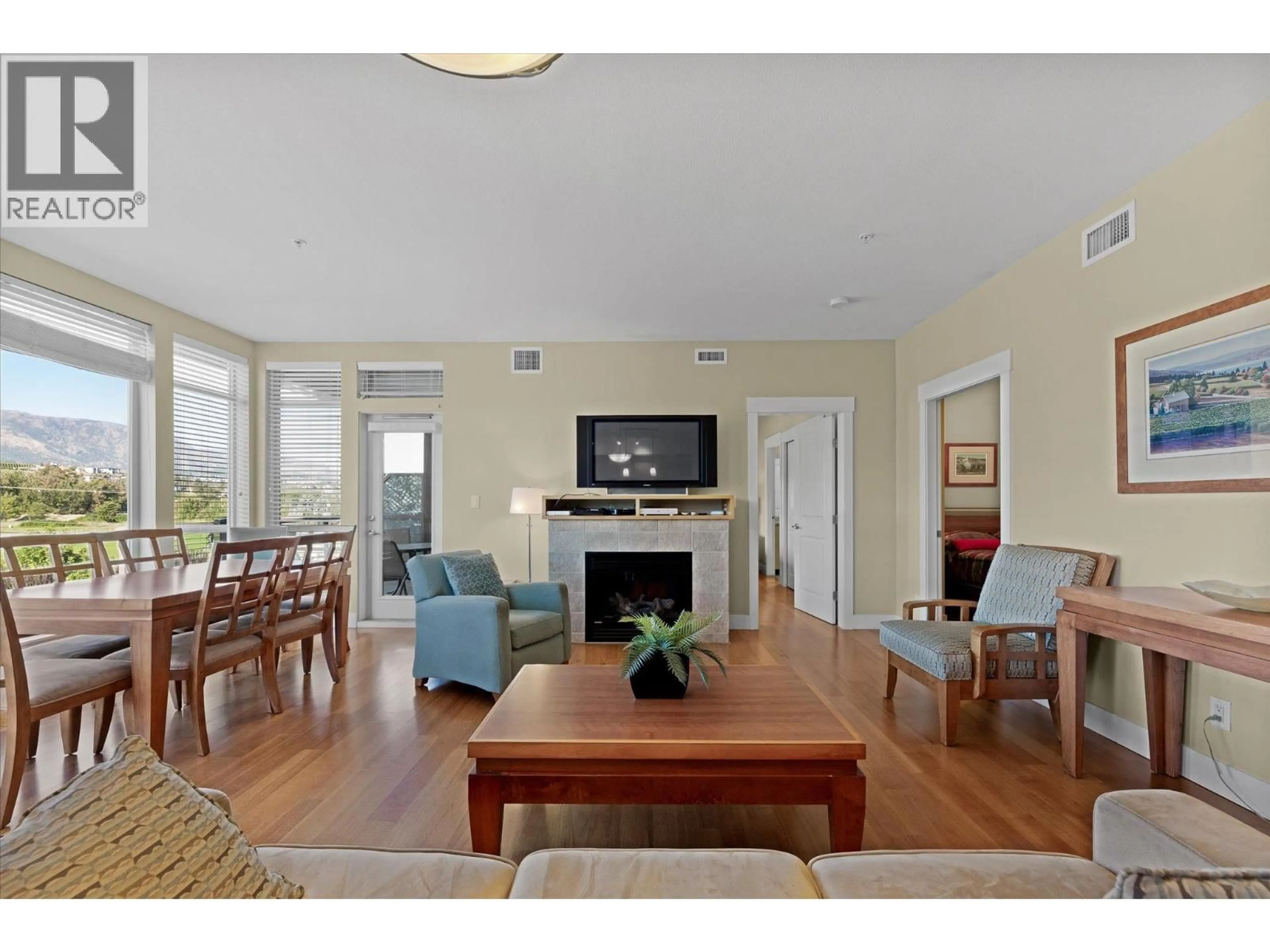 Living room with furniture, wood/laminate floor for 301 - 4205 GELLATLY ROAD, West Kelowna British Columbia V4T2K2