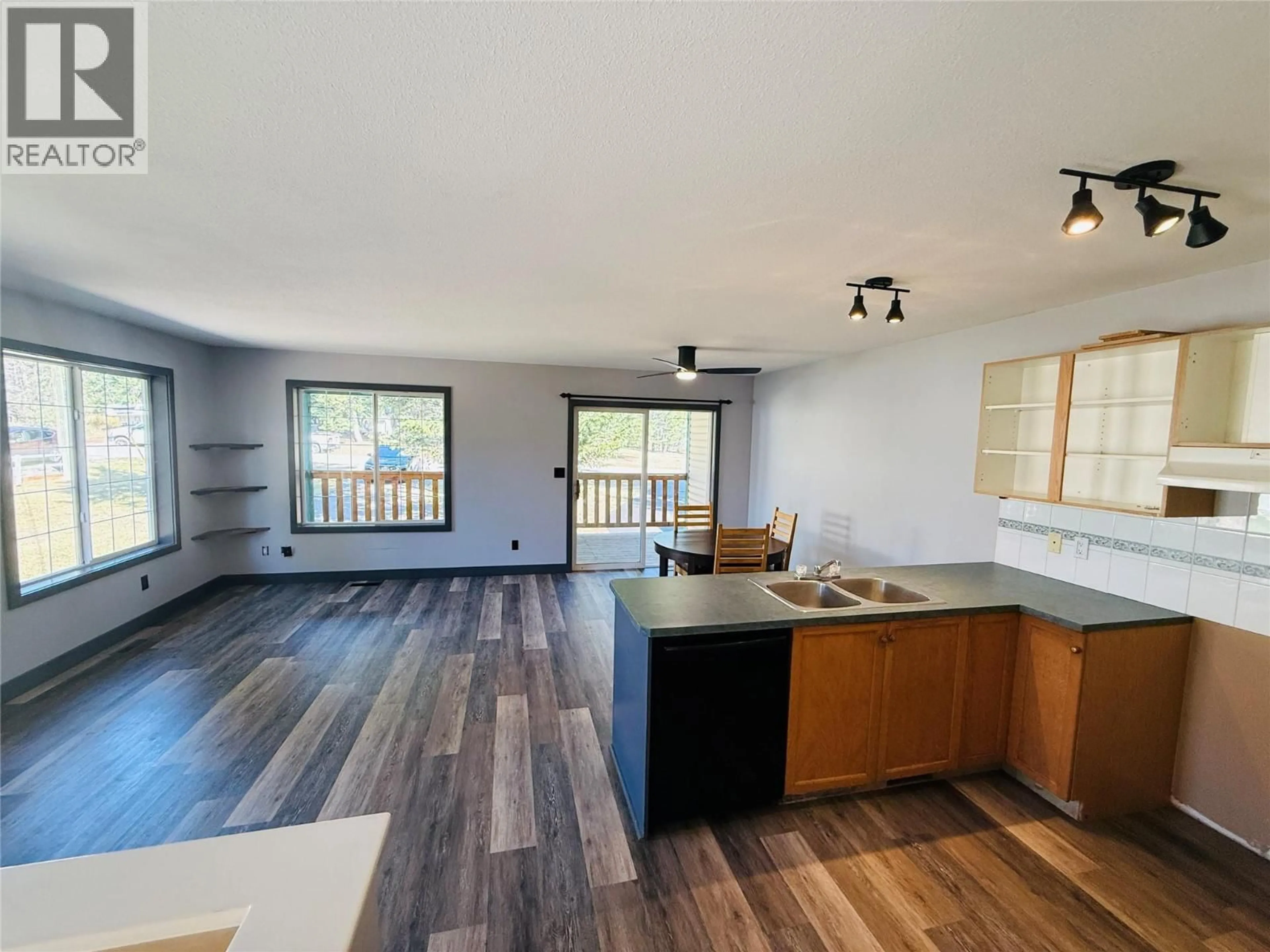 Open concept kitchen, wood/laminate floor for 1B WOLF CRESCENT, Windermere British Columbia V0A1K2