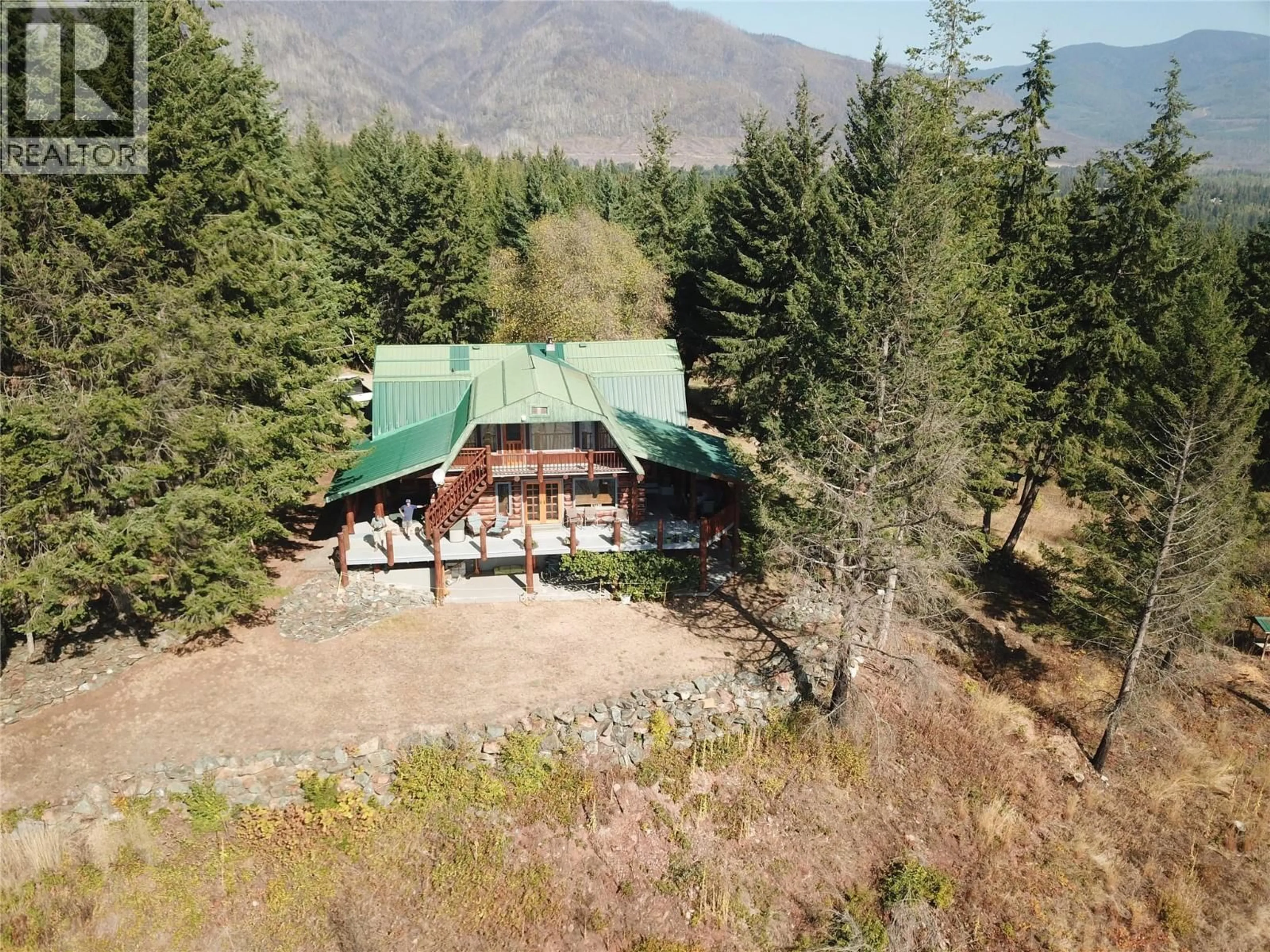 A pic from outside/outdoor area/front of a property/back of a property/a pic from drone, mountain view for 4878 LEOPOLD ROAD, Celista British Columbia V0E1M6