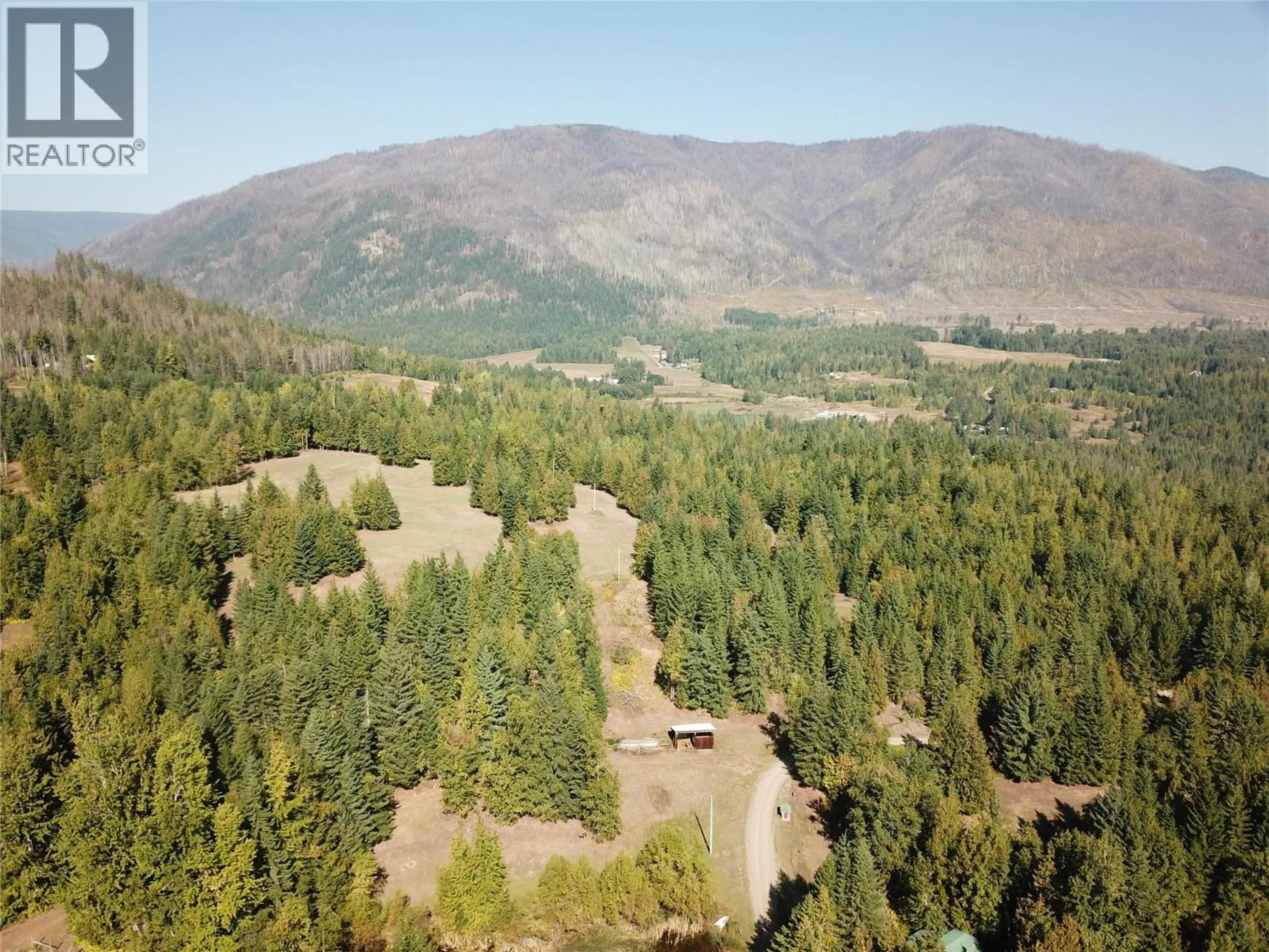 A pic from outside/outdoor area/front of a property/back of a property/a pic from drone, forest/trees view for 4878 LEOPOLD ROAD, Celista British Columbia V0E1M6