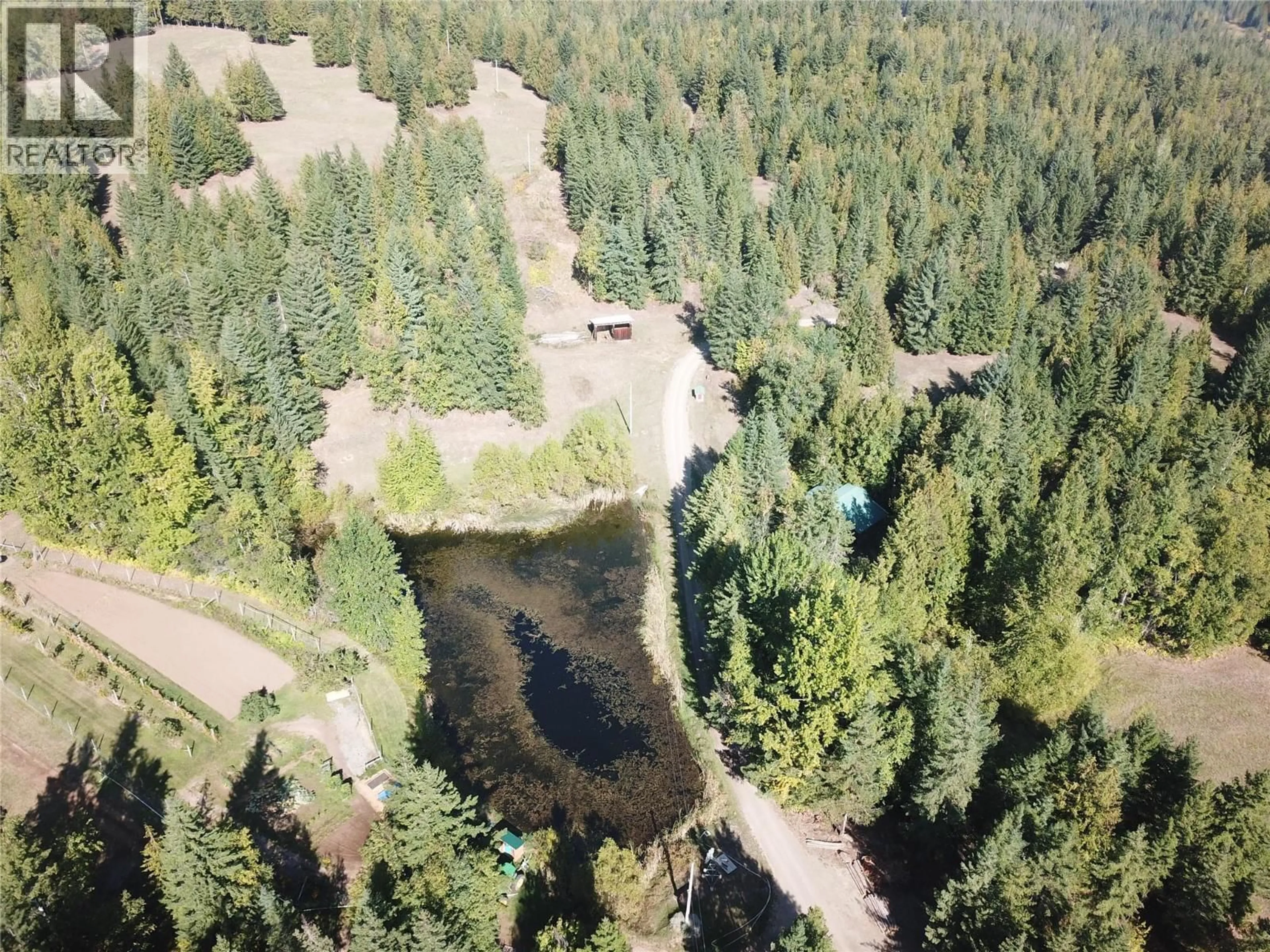 A pic from outside/outdoor area/front of a property/back of a property/a pic from drone, forest/trees view for 4878 LEOPOLD ROAD, Celista British Columbia V0E1M6