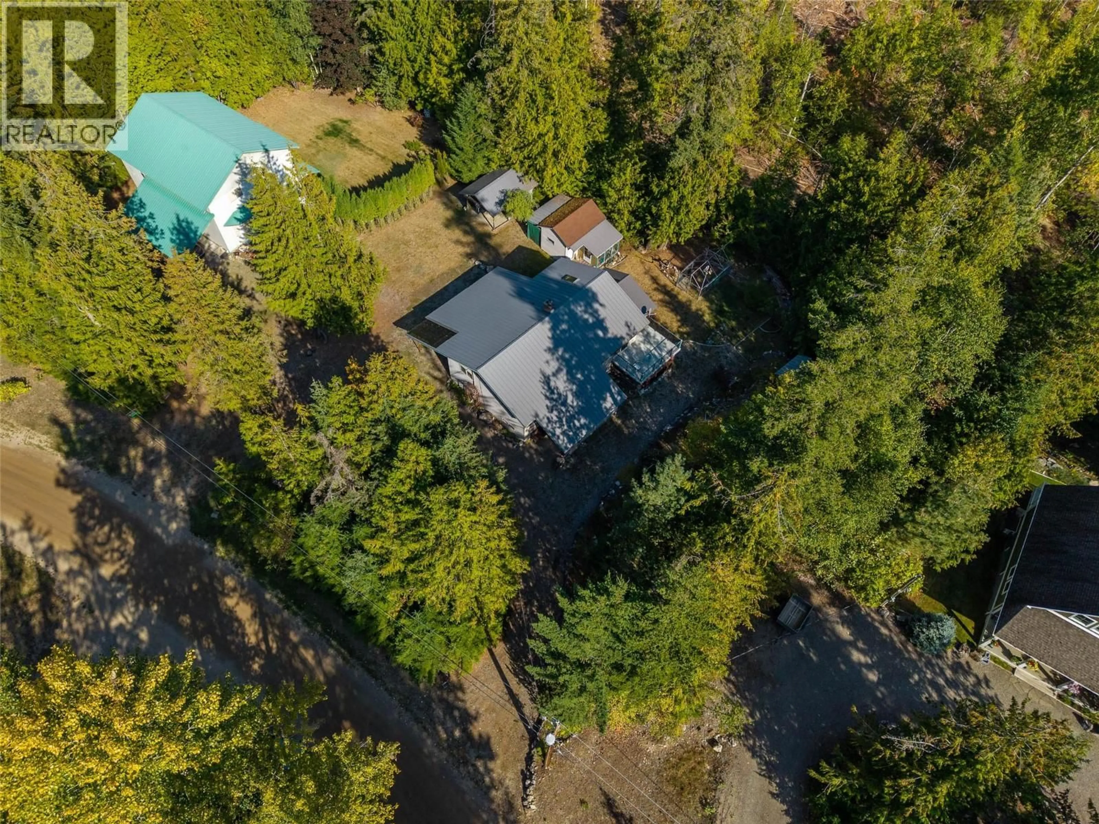 A pic from outside/outdoor area/front of a property/back of a property/a pic from drone, forest/trees view for 7650 MOUNTAIN DRIVE, Anglemont British Columbia V0E1M8