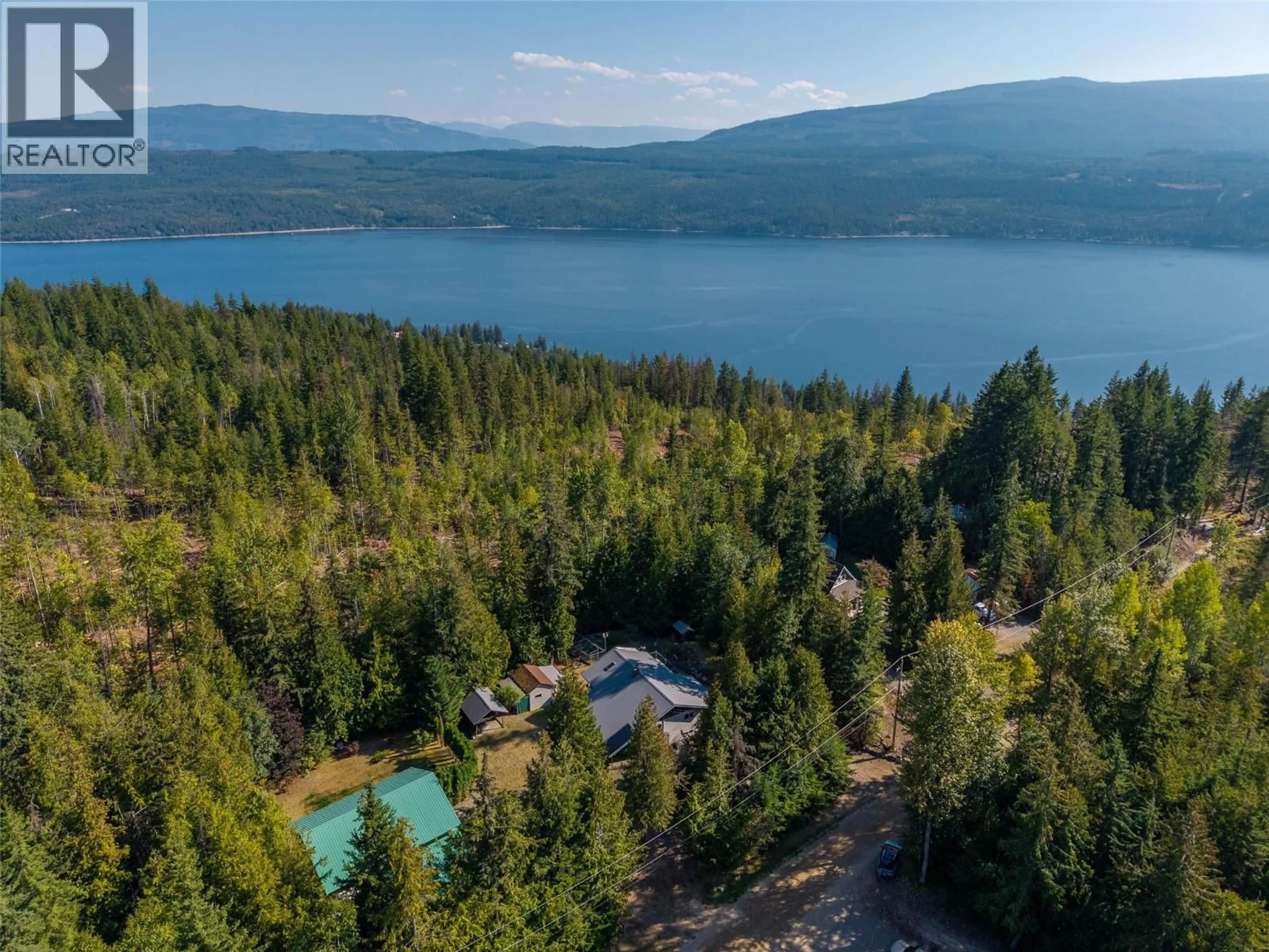A pic from outside/outdoor area/front of a property/back of a property/a pic from drone, water/lake/river/ocean view for 7650 MOUNTAIN DRIVE, Anglemont British Columbia V0E1M8