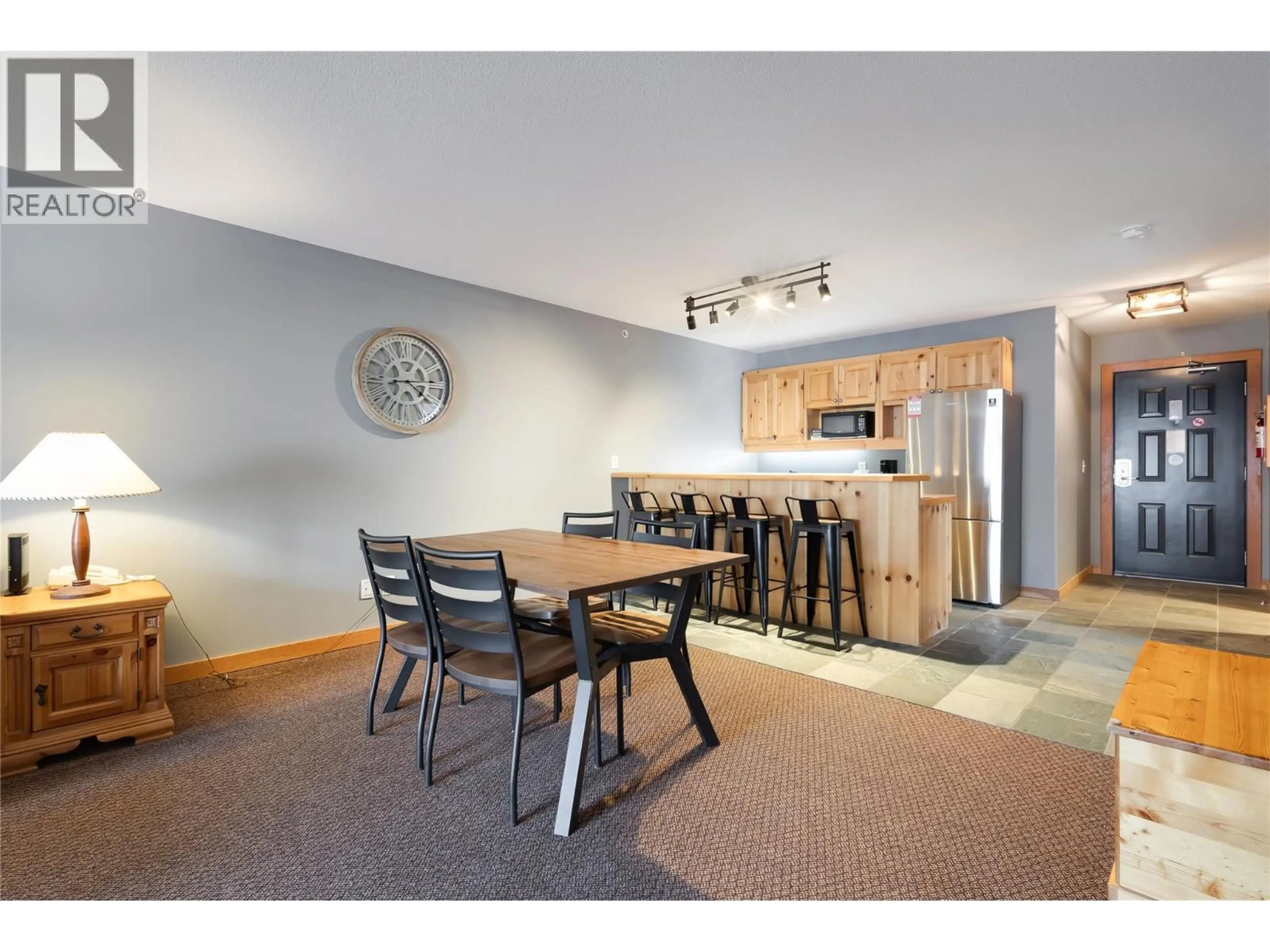 Open concept kitchen, wood/laminate floor for 401 - 5335 BIG WHITE ROAD, Big White British Columbia V1P1T4