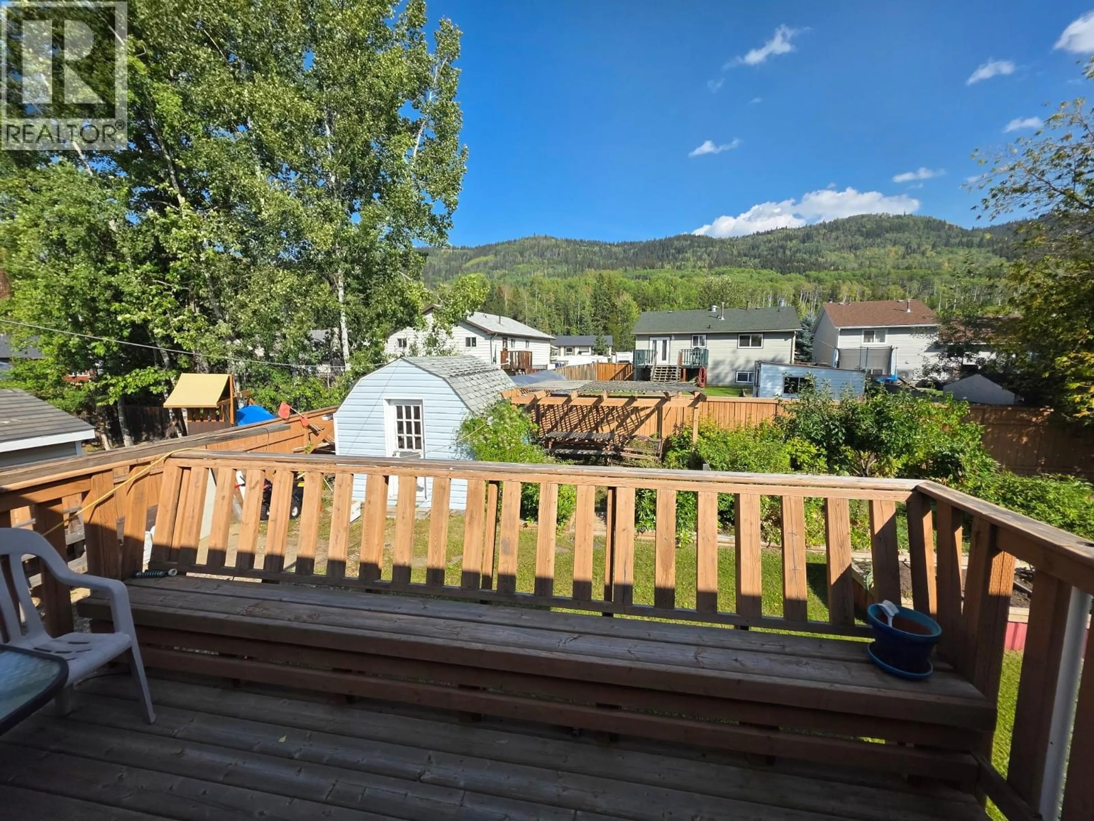A pic from outside/outdoor area/front of a property/back of a property/a pic from drone, mountain view for 128 QUALITY CRESCENT, Tumbler Ridge British Columbia v0c2w0