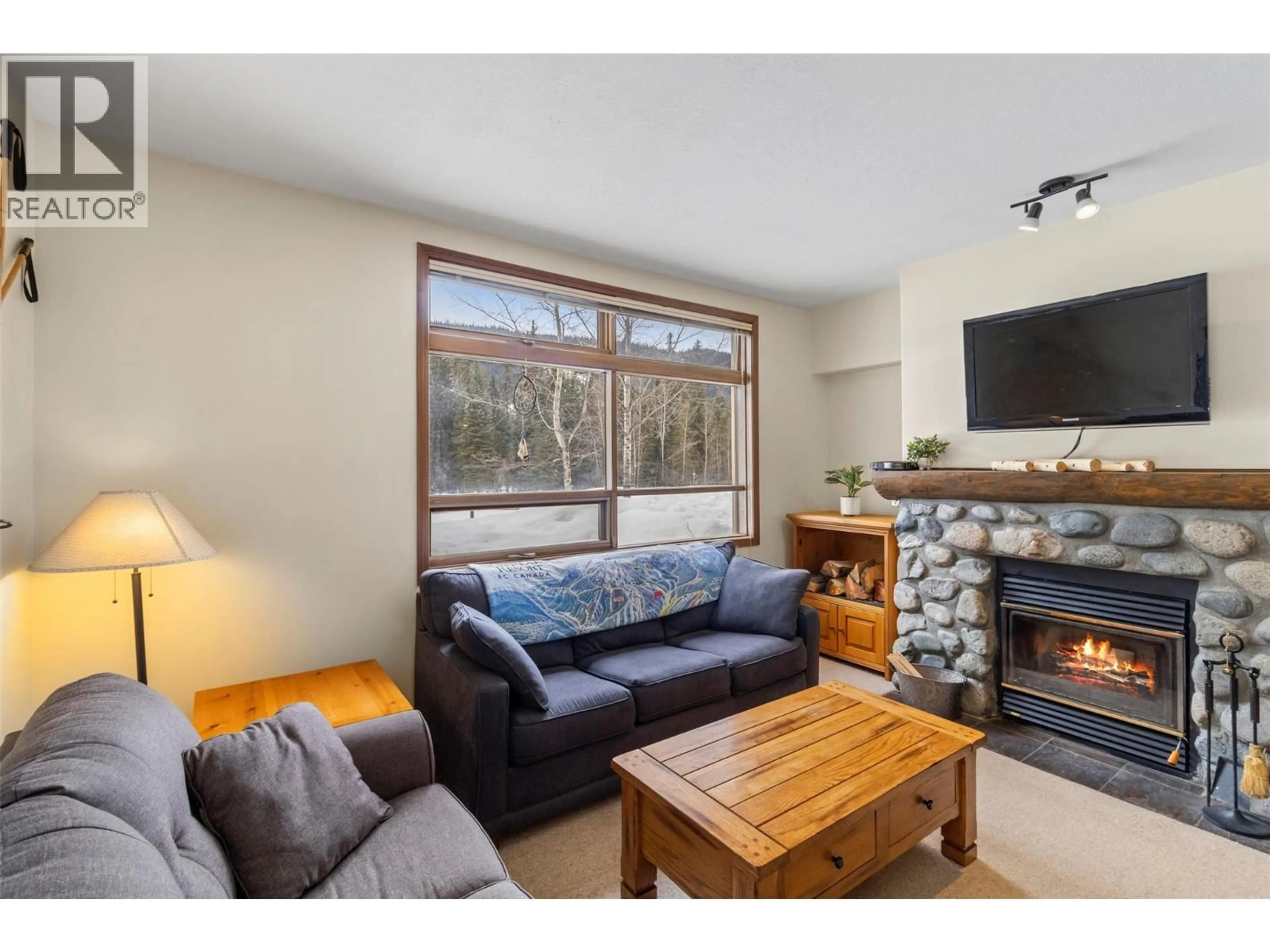 Living room with furniture, wood/laminate floor for 15 - 2140 SUN PEAKS ROAD, Sun Peaks British Columbia V0E5N0