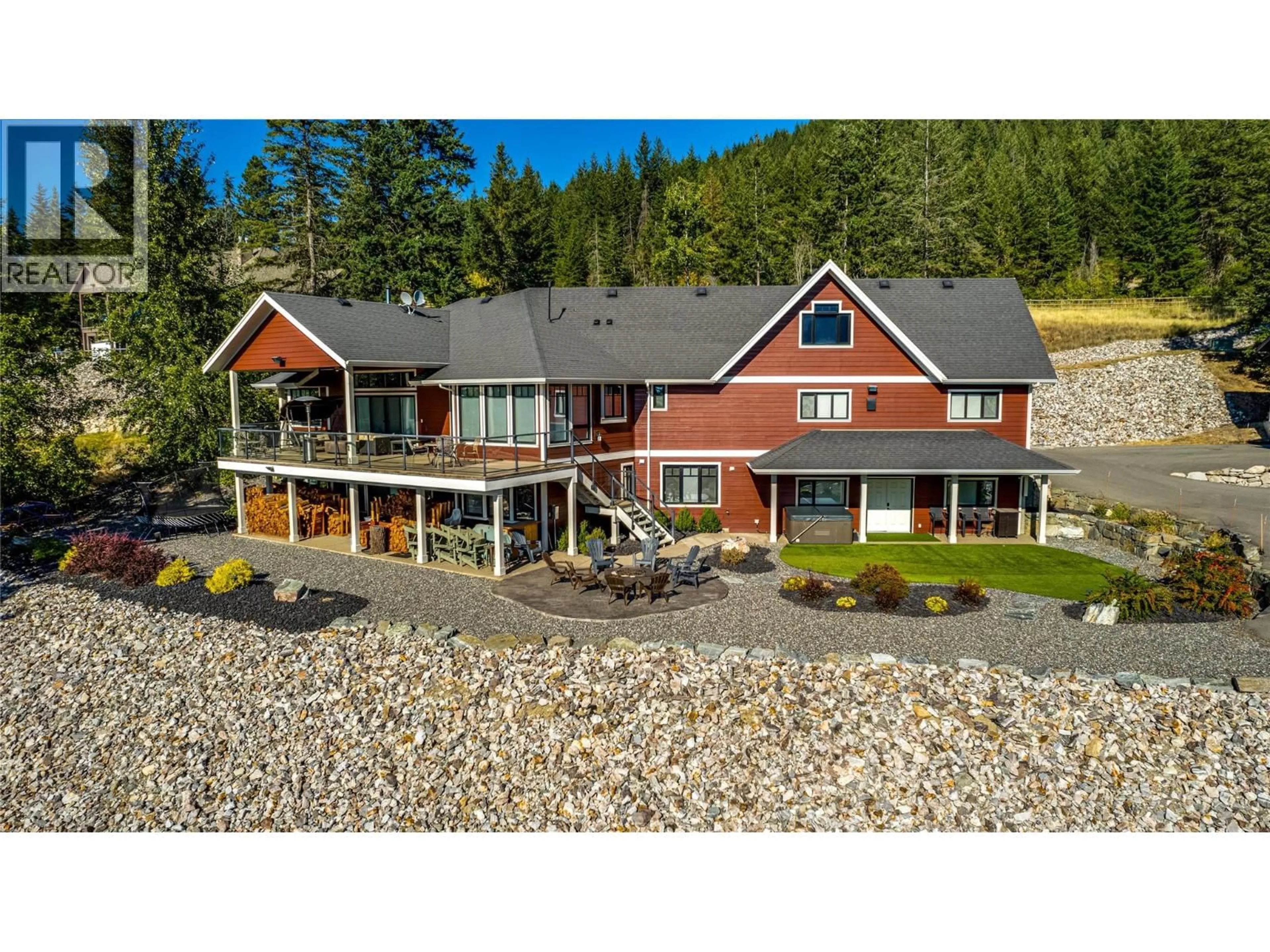 A pic from outside/outdoor area/front of a property/back of a property/a pic from drone, water/lake/river/ocean view for 6054 LYNX DRIVE, Vernon British Columbia V1B3J5