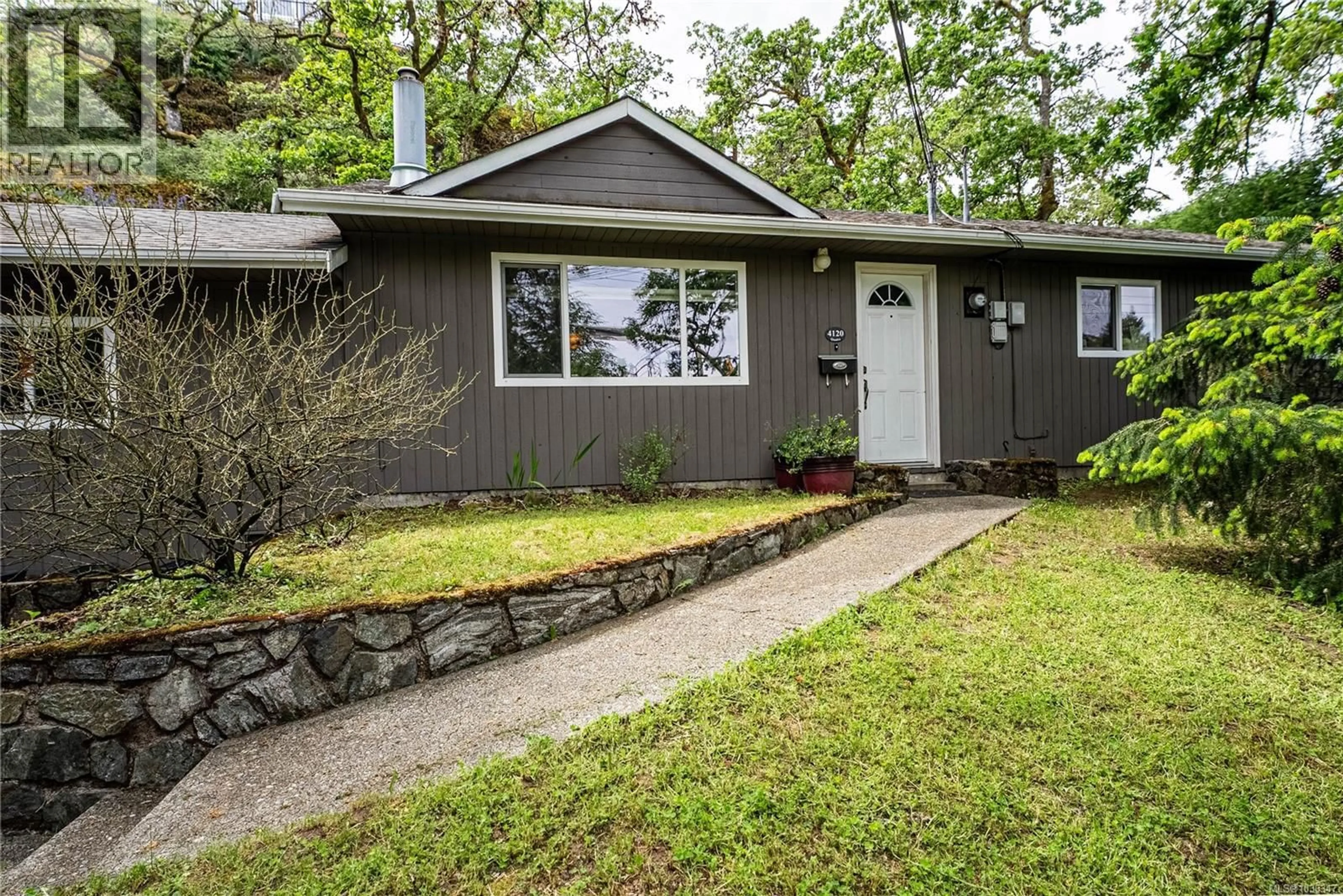 Home with vinyl exterior material, street for 4120 QUADRA STREET, Saanich British Columbia V8X3B9