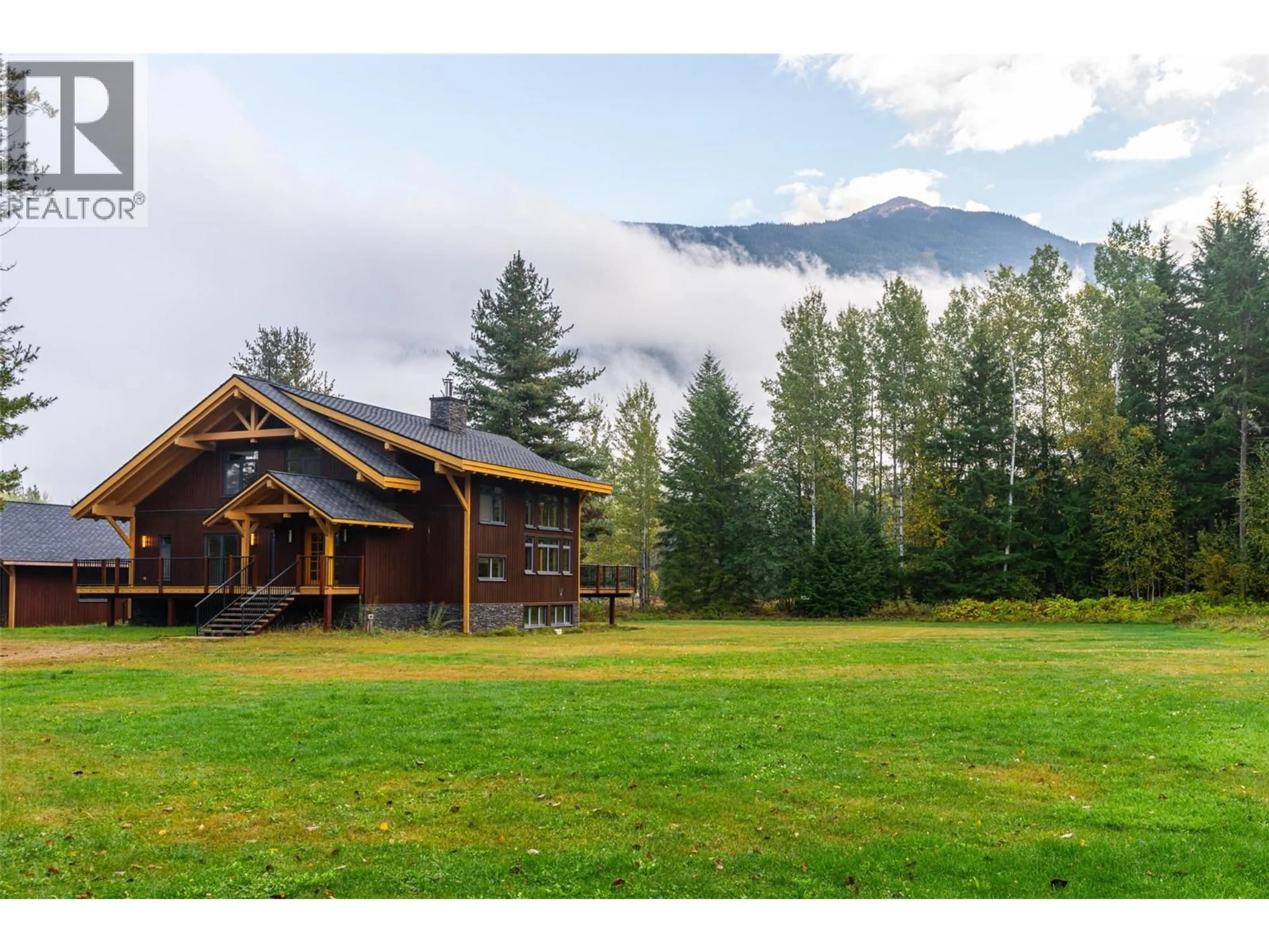 A pic from outside/outdoor area/front of a property/back of a property/a pic from drone, mountain view for 3266 AIRPORT WAY, Revelstoke British Columbia V0E2S3