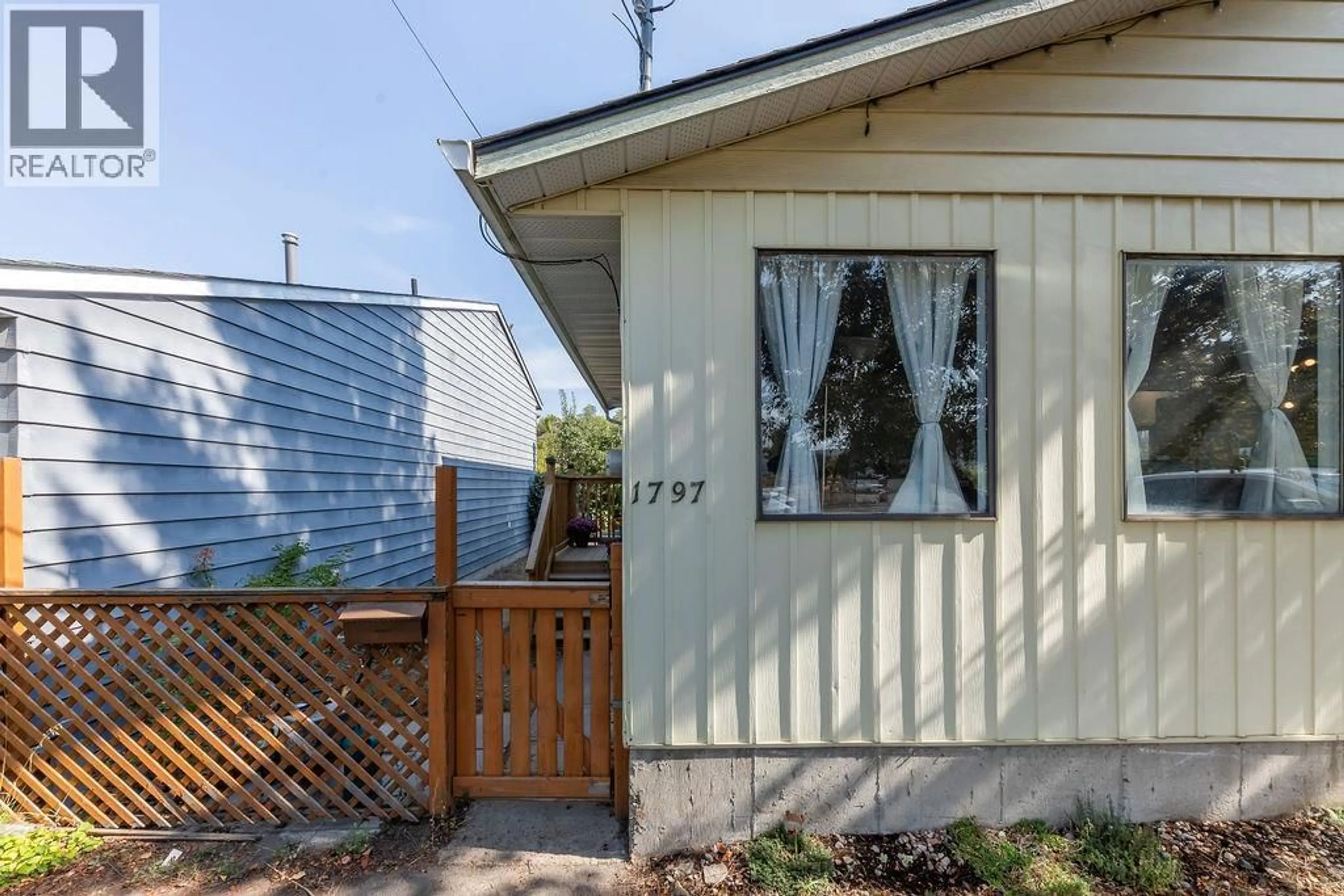 Home with vinyl exterior material, street for 1797 SPRINGHILL DRIVE, Kamloops British Columbia V2E1H8