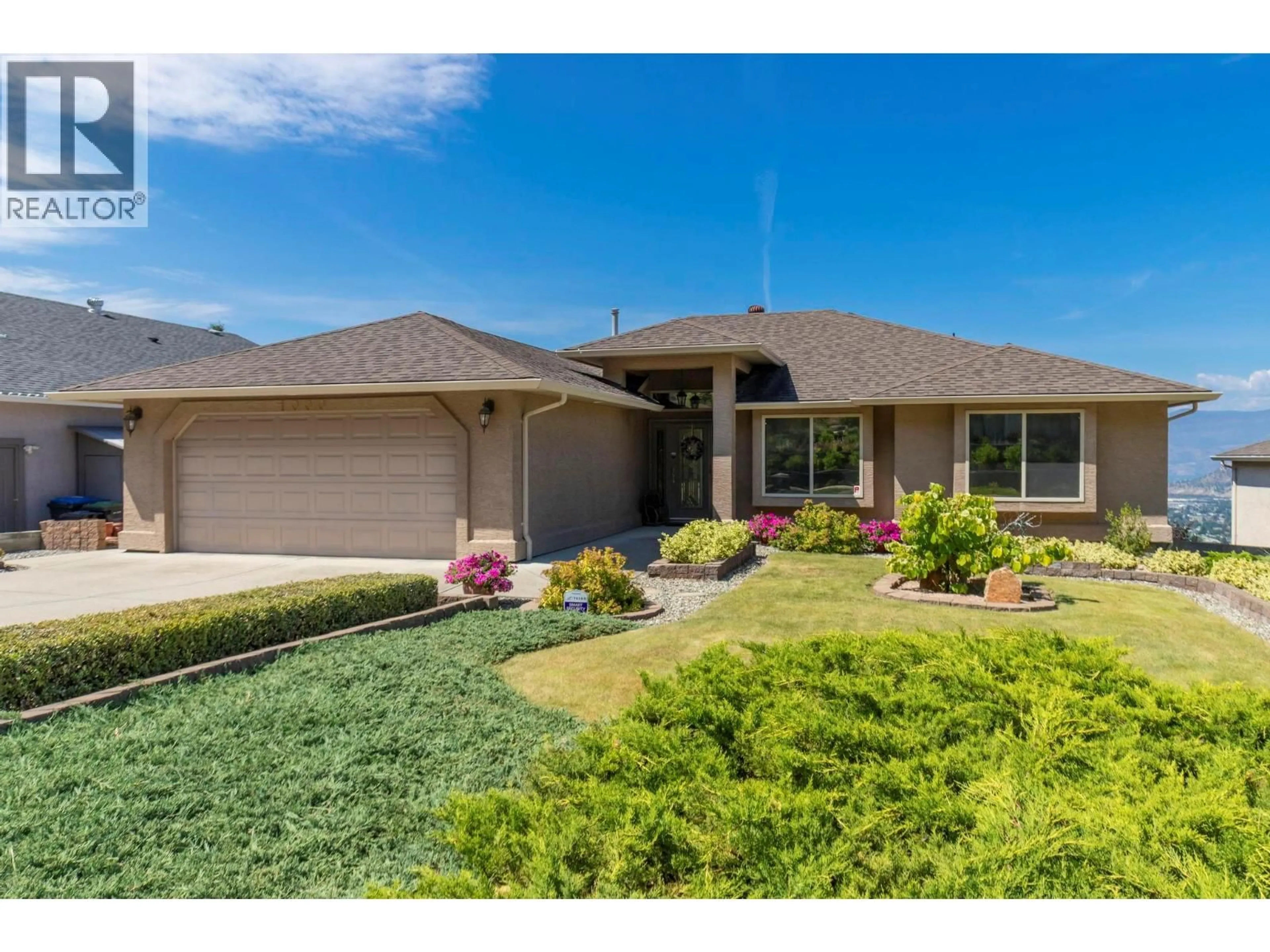 Home with vinyl exterior material, street for 1000 LONE PINE DRIVE, Kelowna British Columbia V1P1M7