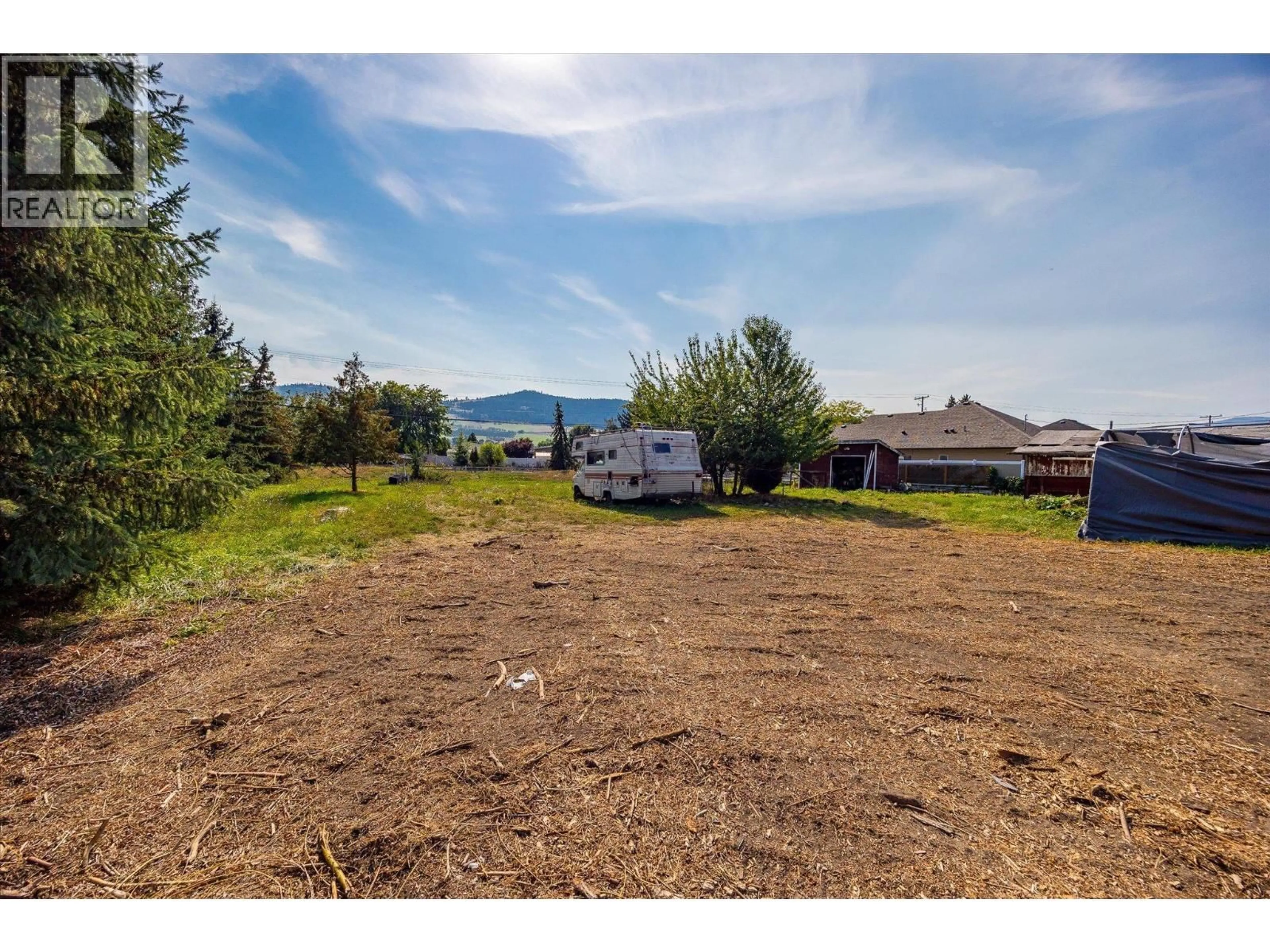 A pic from outside/outdoor area/front of a property/back of a property/a pic from drone, mountain view for 6638 SCOTT ROAD, Vernon British Columbia V1H1N3