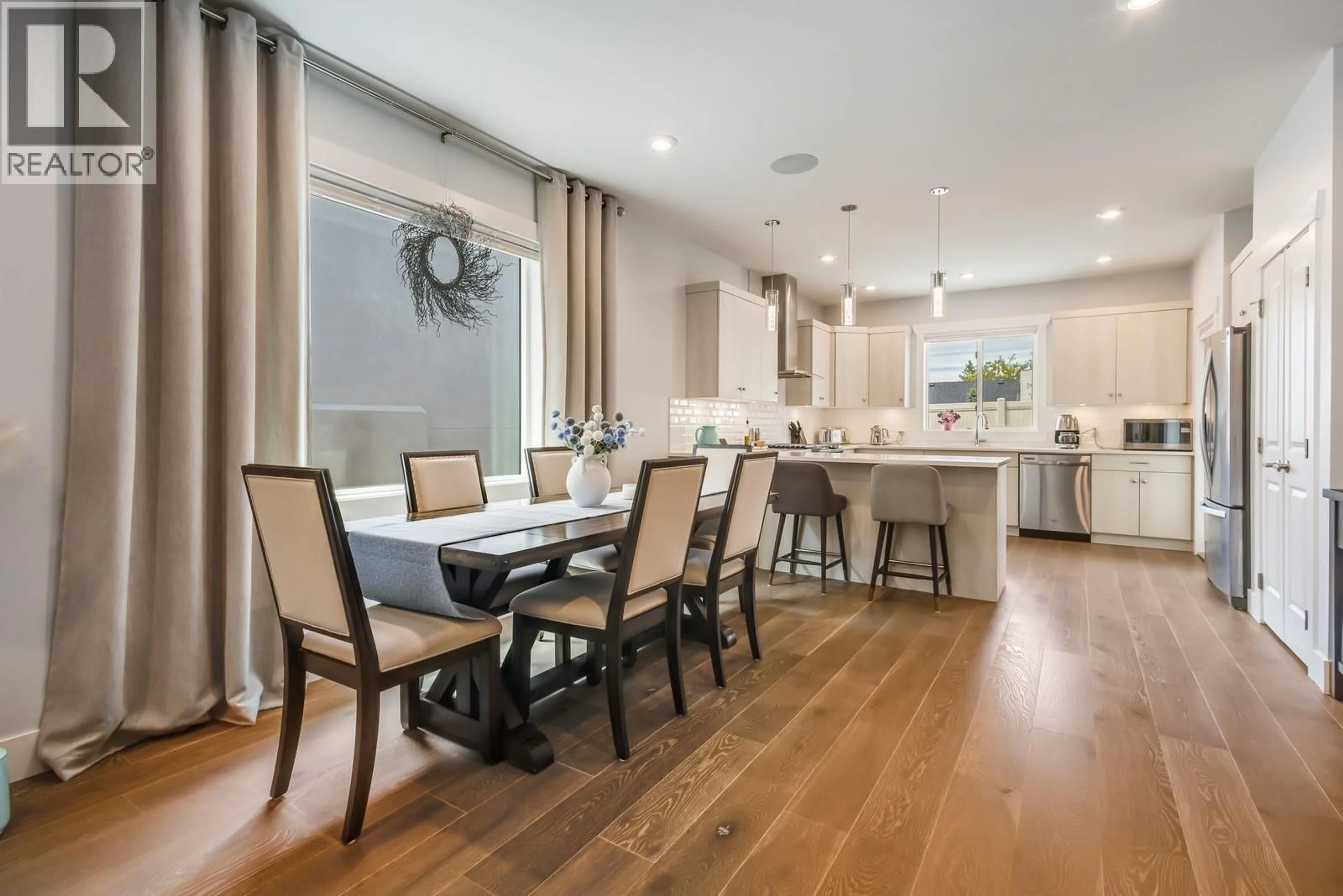 Open concept kitchen, wood/laminate floor for 3118 RIESLING WAY, West Kelowna British Columbia V4T3M7