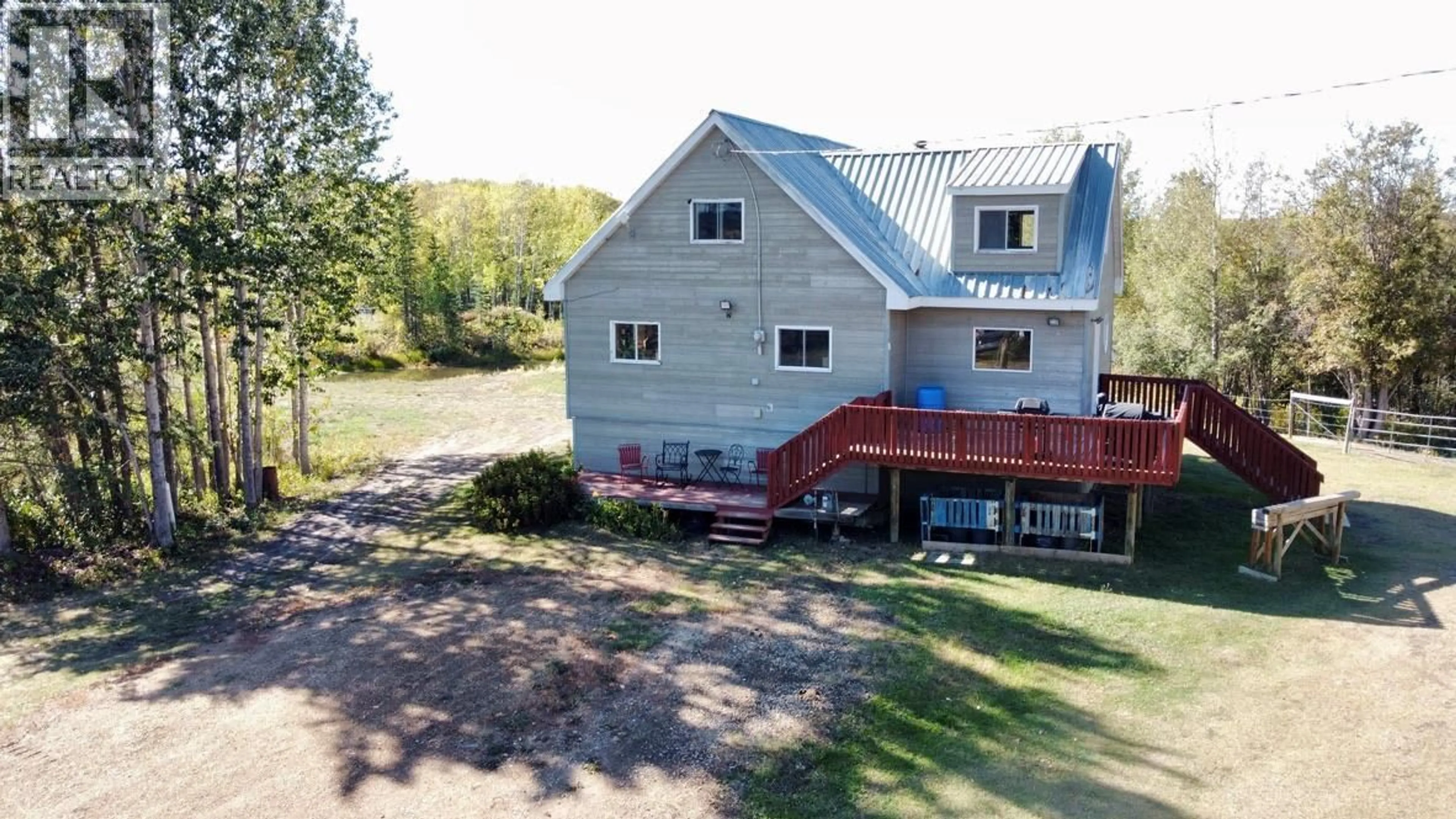 A pic from outside/outdoor area/front of a property/back of a property/a pic from drone, building for 12705 HWY 52 N OTHER, Dawson Creek British Columbia V0C1B0