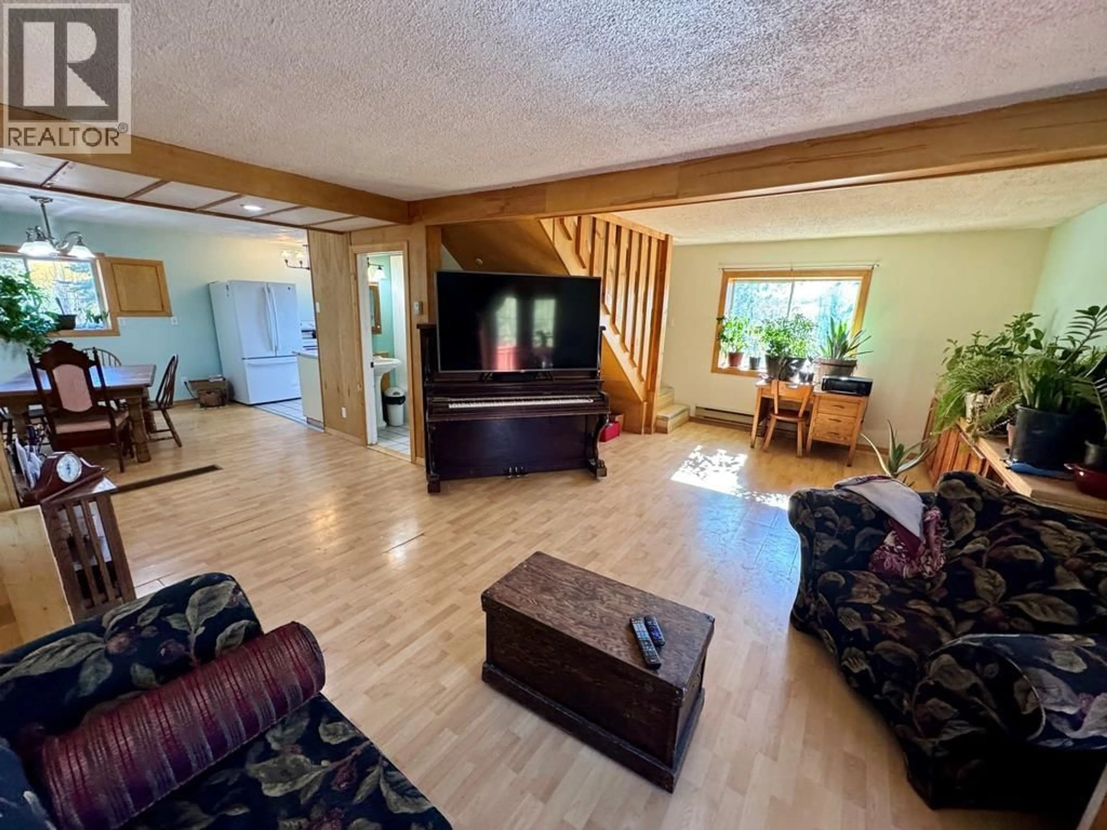 Living room with furniture, wood/laminate floor for 12705 HWY 52 N OTHER, Dawson Creek British Columbia V0C1B0