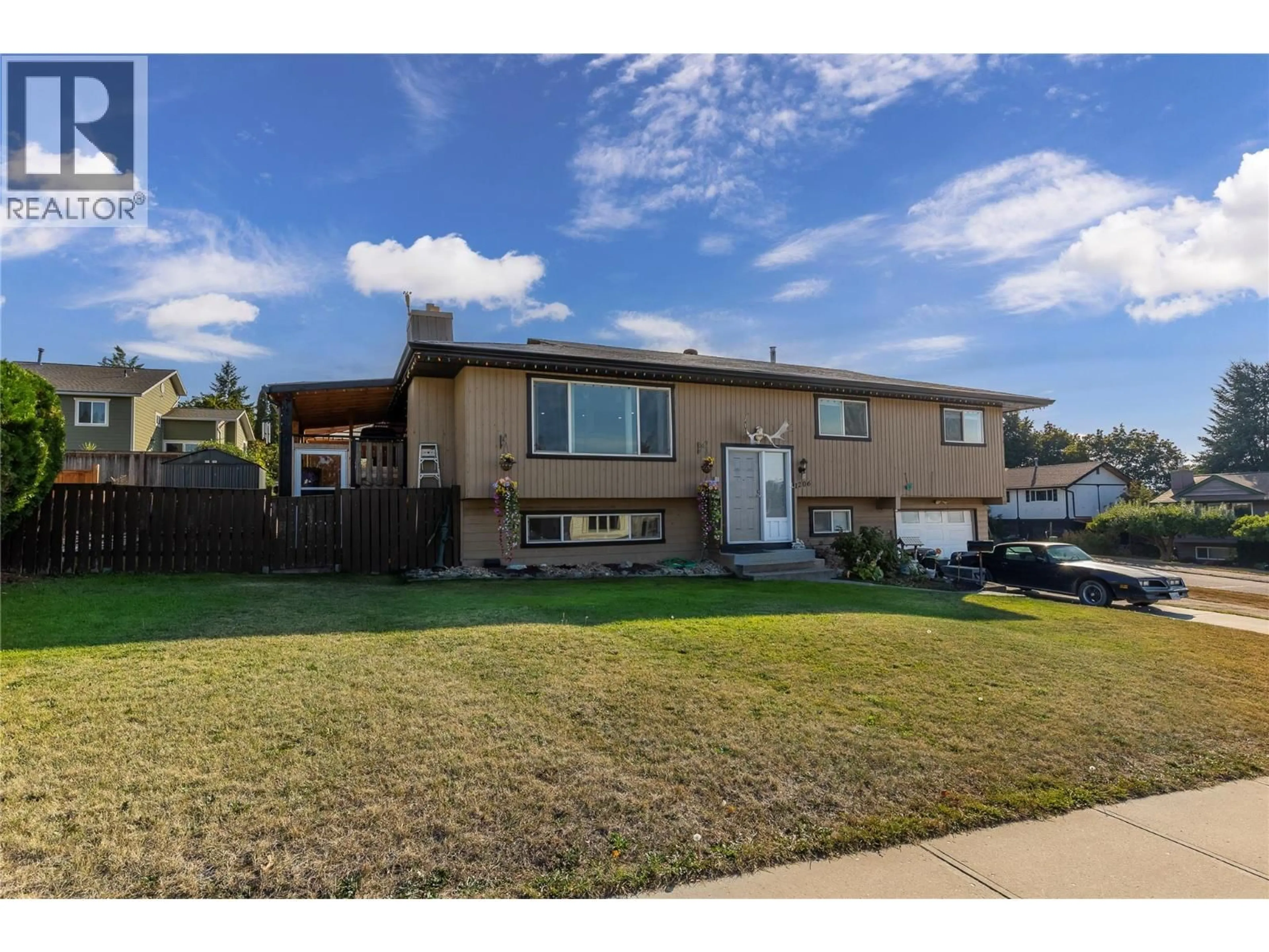 Home with vinyl exterior material, street for 1206 43 AVENUE, Vernon British Columbia V1T8C9